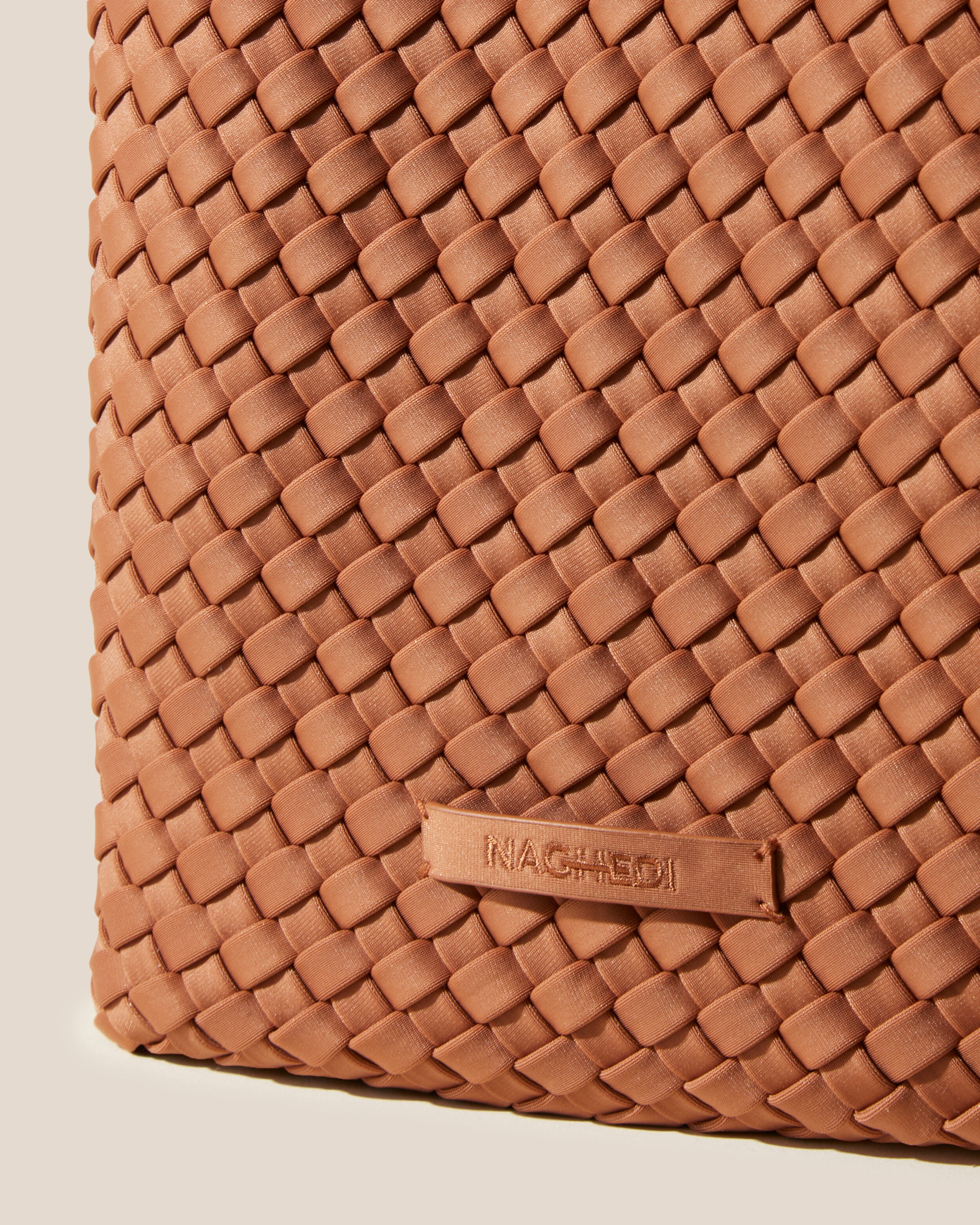 Close-up of stamped NAGHEDI logo on St. Barths Tote in Cocoa.