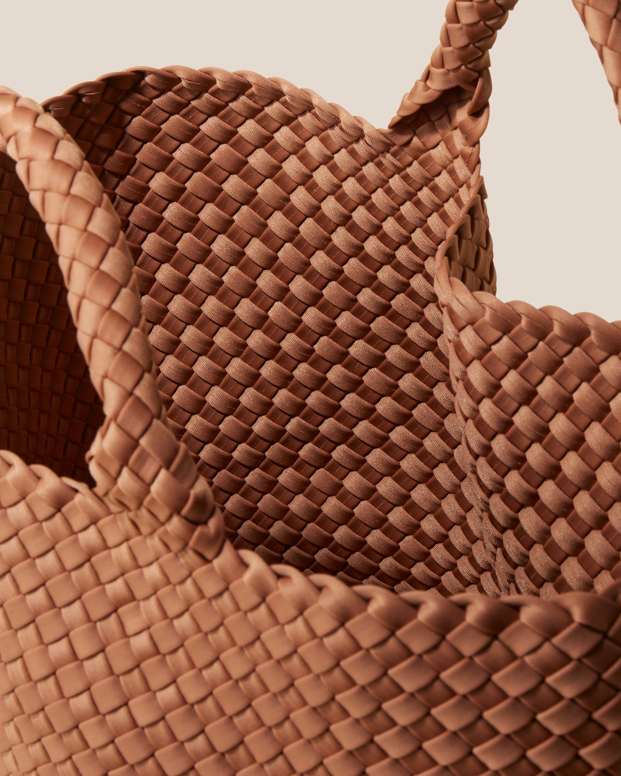 Interior close-up of St. Barths Tote in Cocoa showing its open top, and unlined interior.