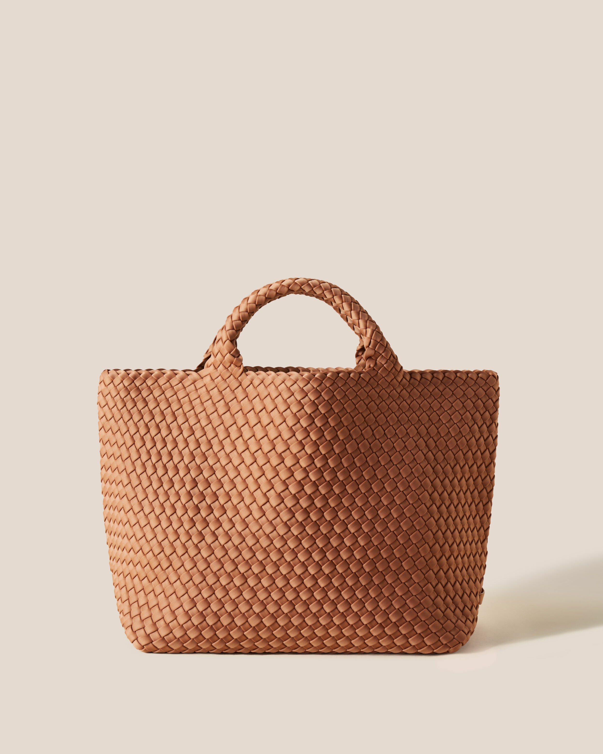 St. Barths Tote in Cocoa, a mocha brown tone, in handwoven neoprene, featuring an open top, and woven top handles.