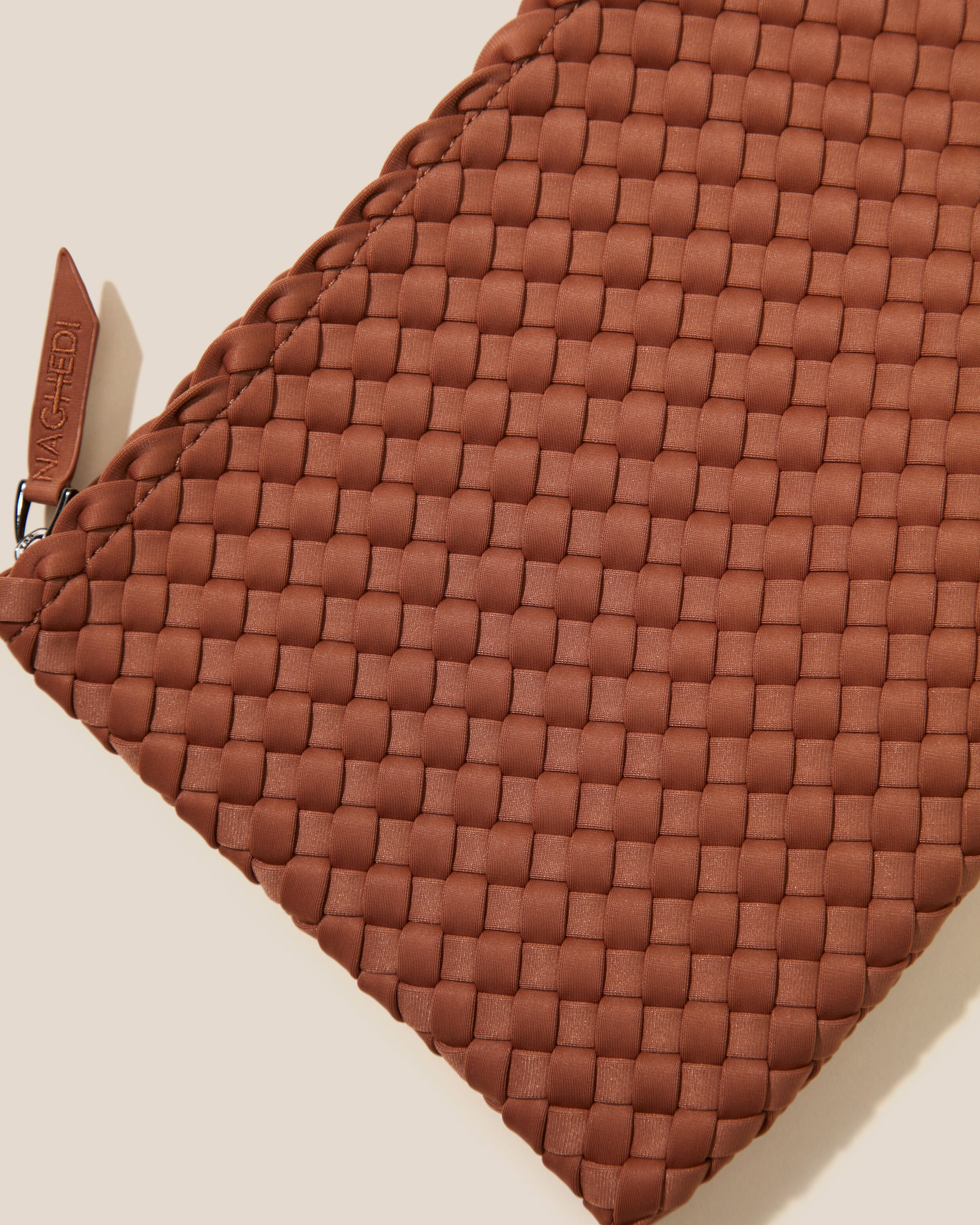 Close-up of included matching woven zippered pouch.