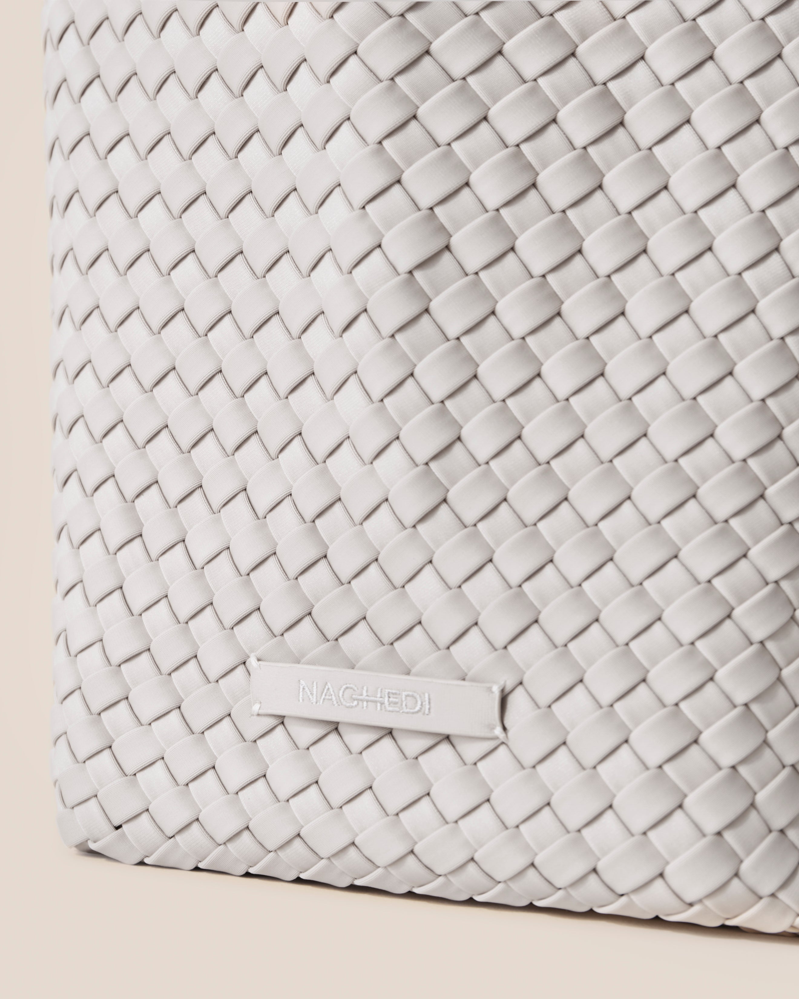 Close-up of stamped NAGHEDI logo on St. Barths Tote in Dove.