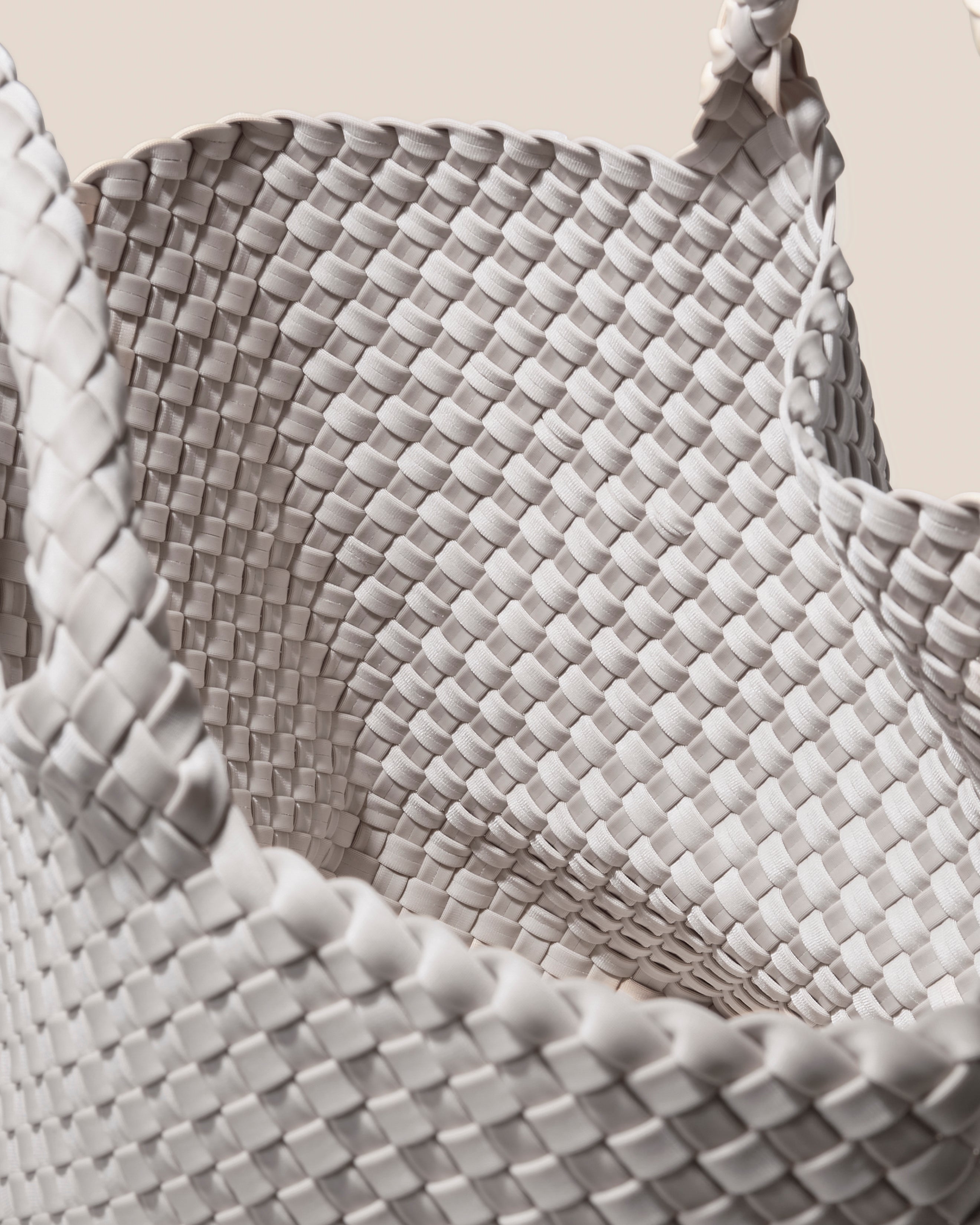 Interior close-up of St. Barths Tote in Dove showing its open top, and unlined interior.