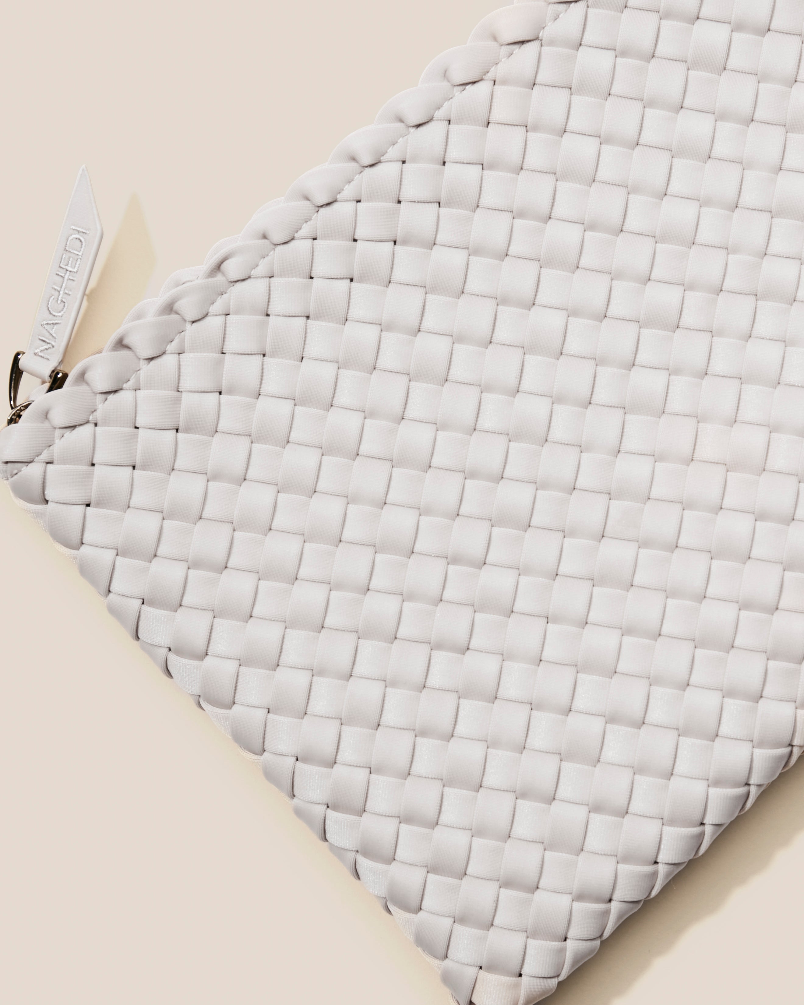 Close-up of included matching woven zippered pouch.