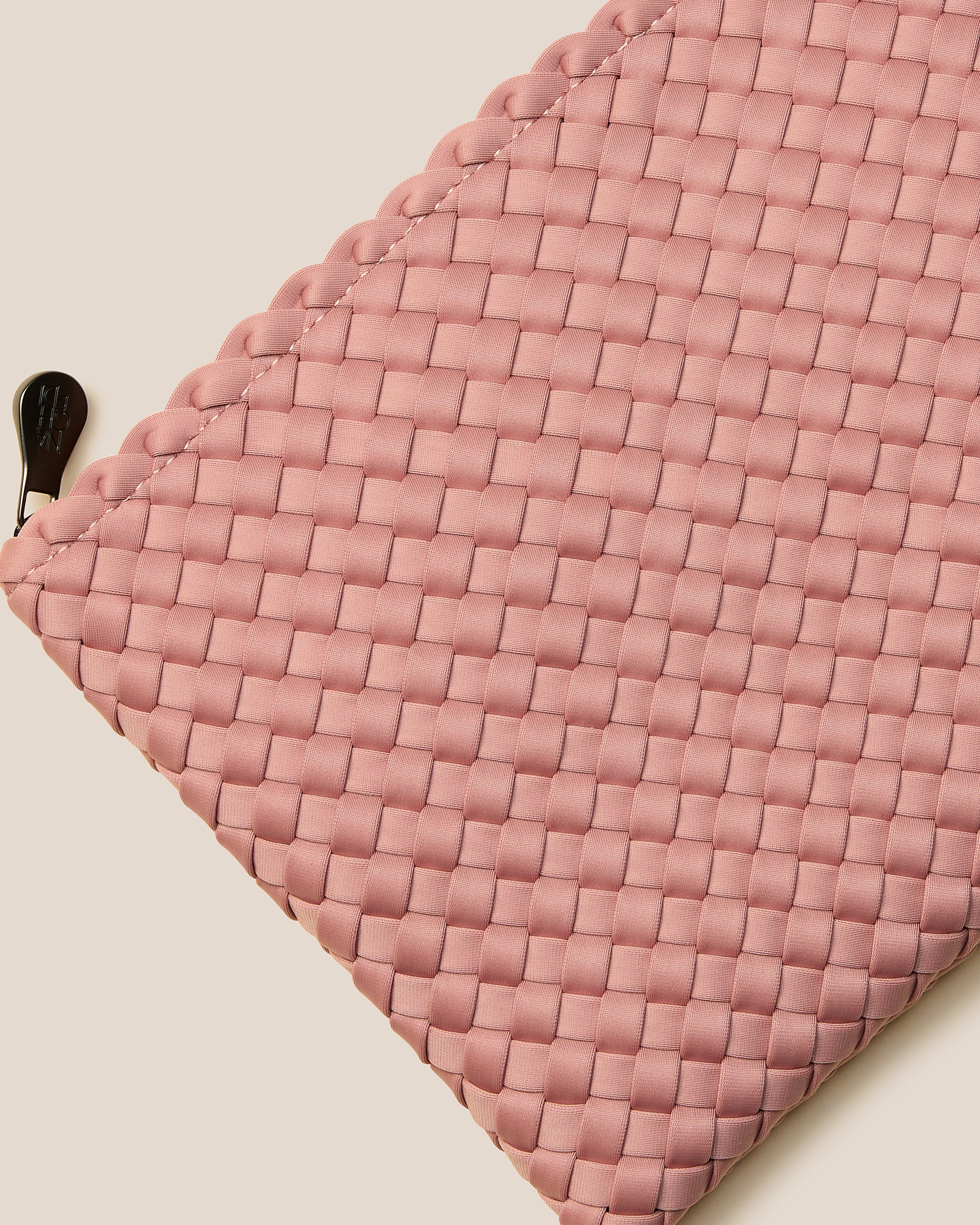 Close-up of included matching woven zippered pouch.