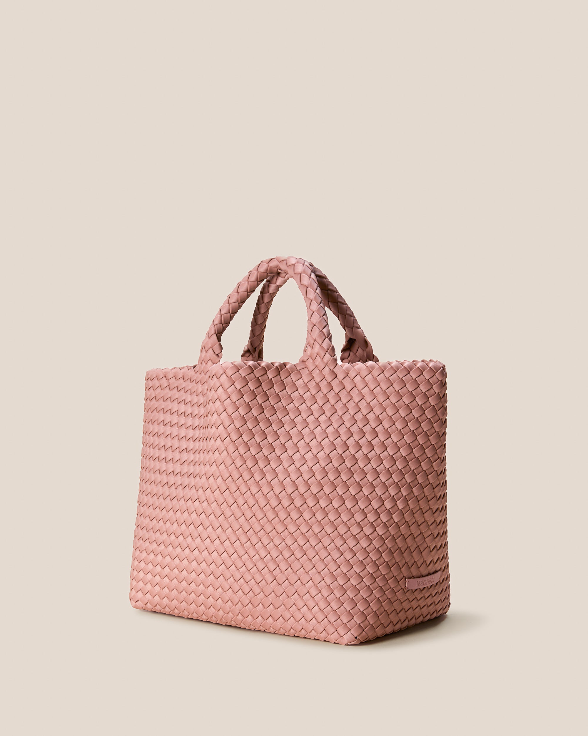 St. Barths Medium Tote Bag in Dusk shown from a side angle, highlighting its handwoven neoprene and open top.
