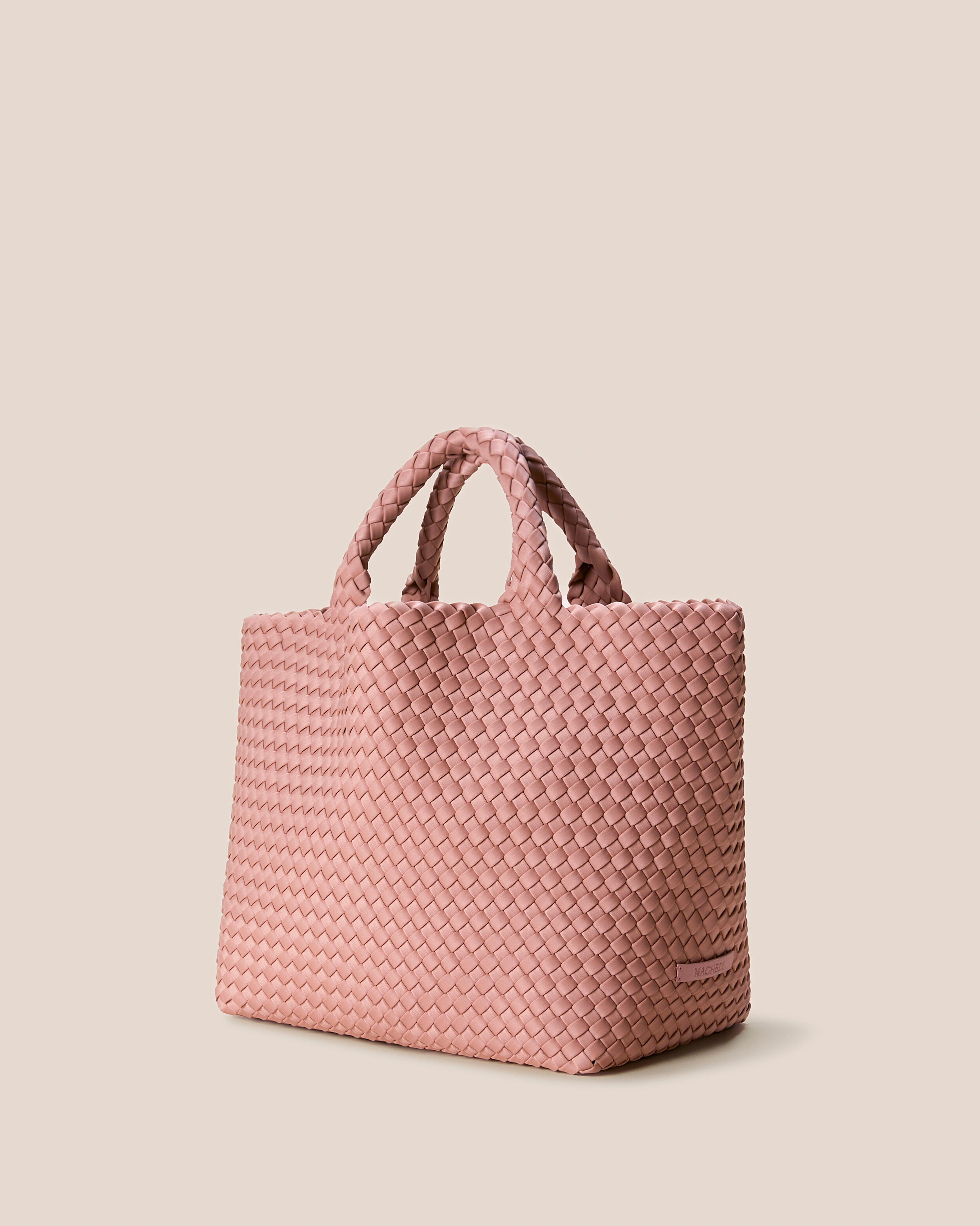 St. Barths Tote in Dusk shown from a side angle, highlighting its handwoven neoprene construction and open top.