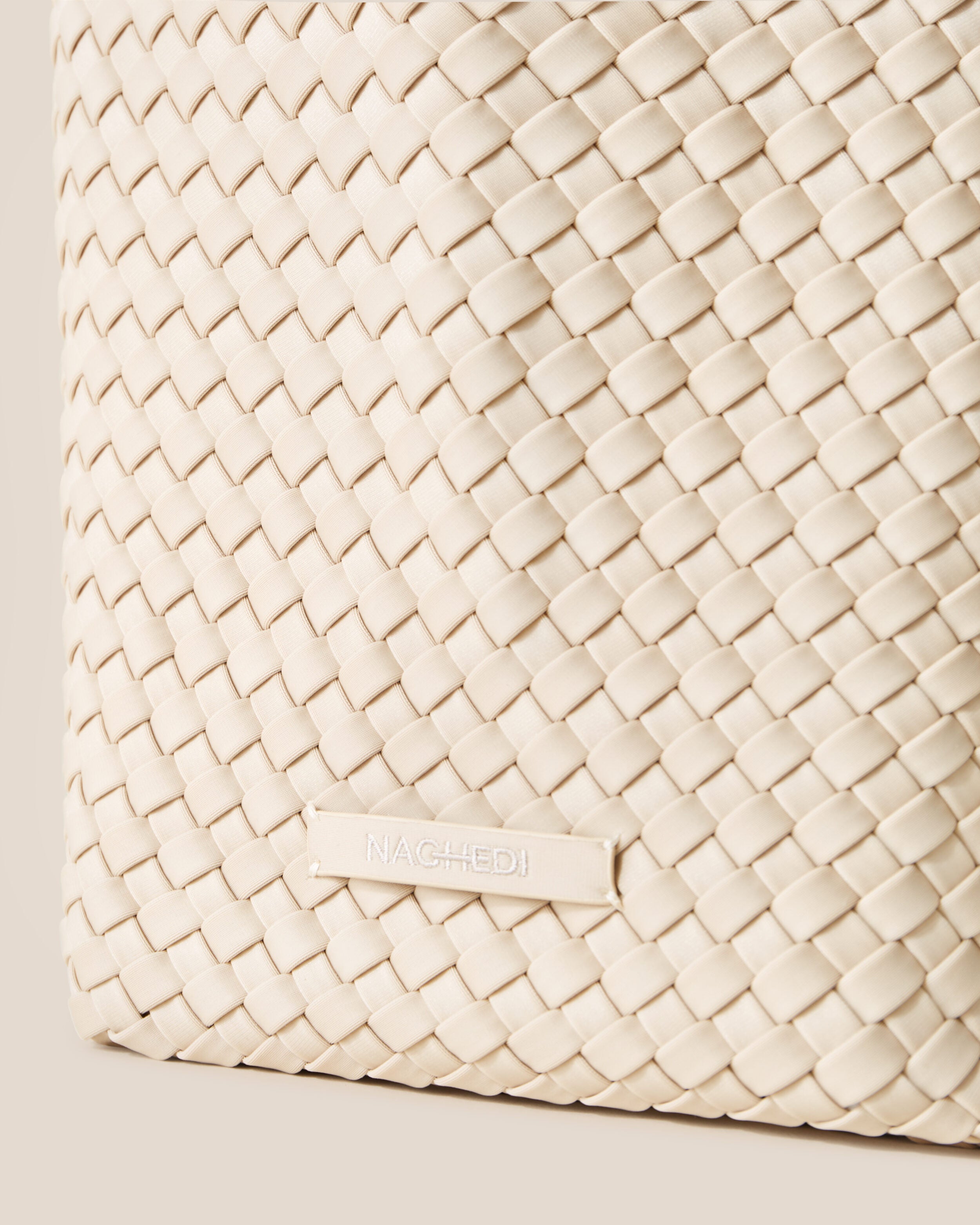 Close-up of stamped NAGHEDI logo on St. Barths Tote in Ecru.