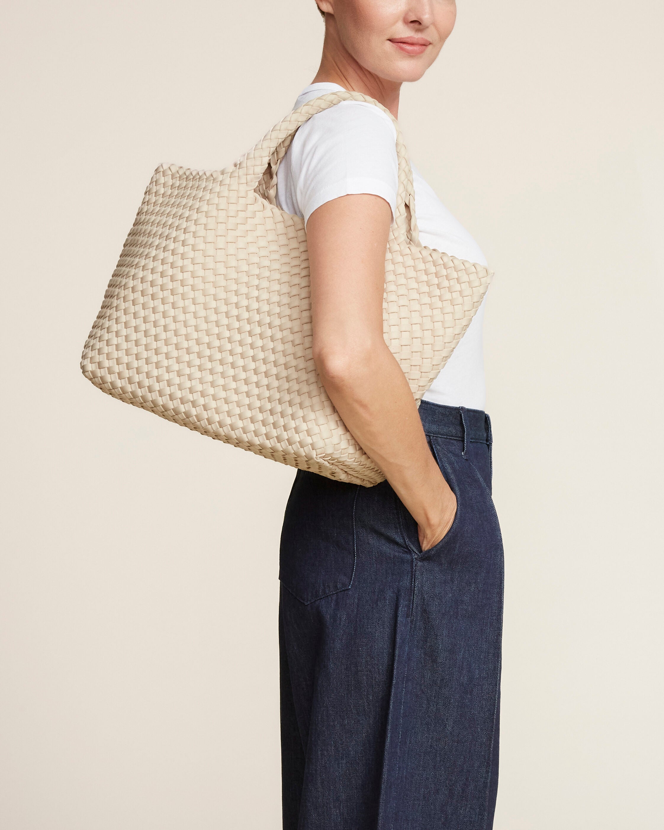 St. Barths Tote in Ecru shown on model to illustrate scale and soft silhouette.