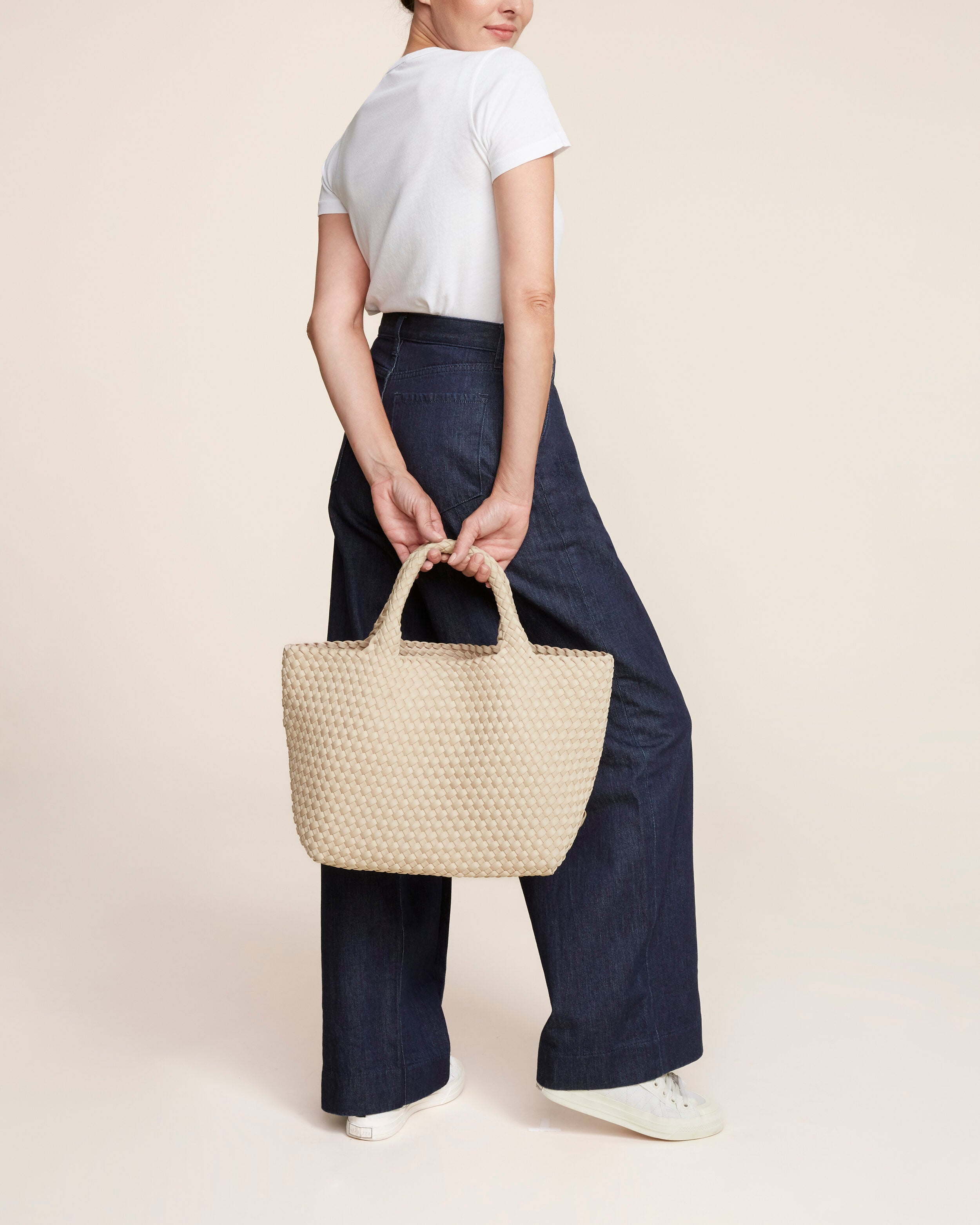 St. Barths Tote in Ecru shown on model to illustrate scale and soft silhouette.