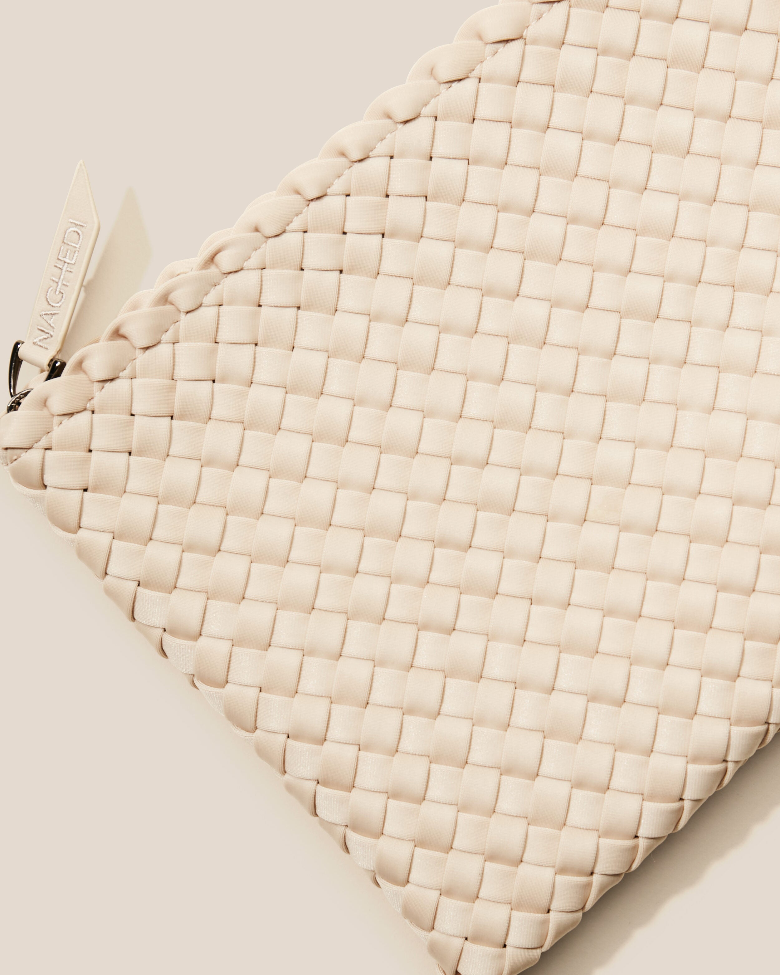 Close-up of included matching woven zippered pouch.