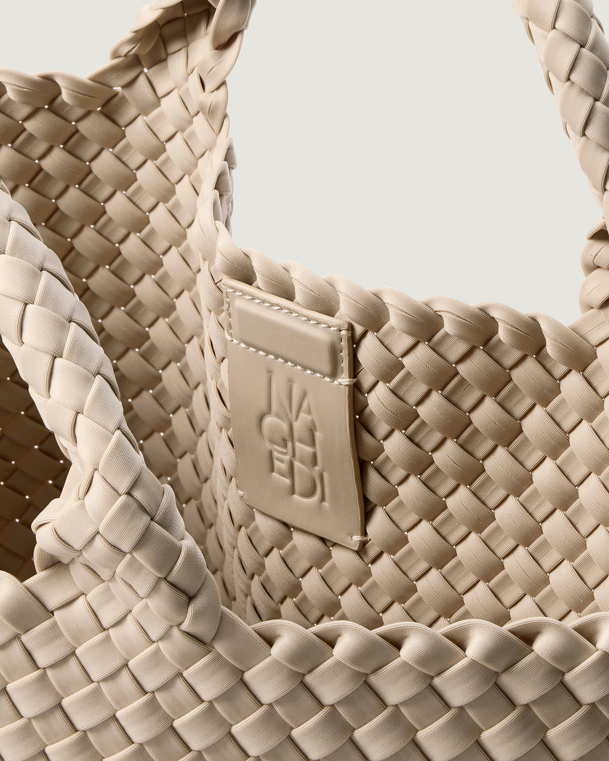 Interior close-up of St. Barths Tote in Ecru showing its magnetic snap closure, and unlined interior.