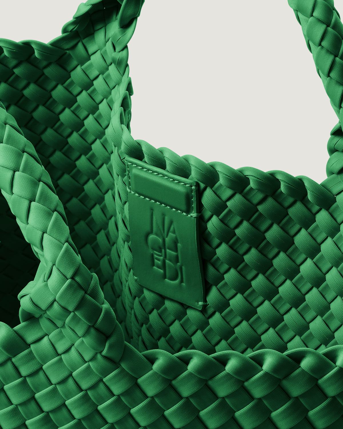 Interior close-up of St. Barths Tote in Emerald showing its magnetic snap closure, and unlined interior.