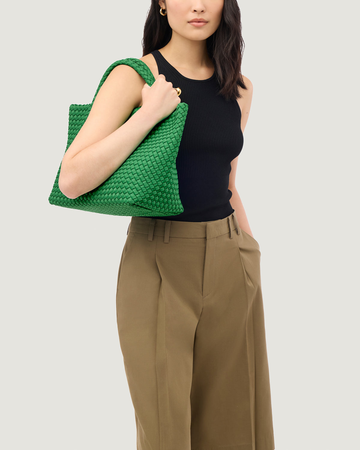 St. Barths Tote in Emerald shown on model to illustrate scale and soft silhouette.