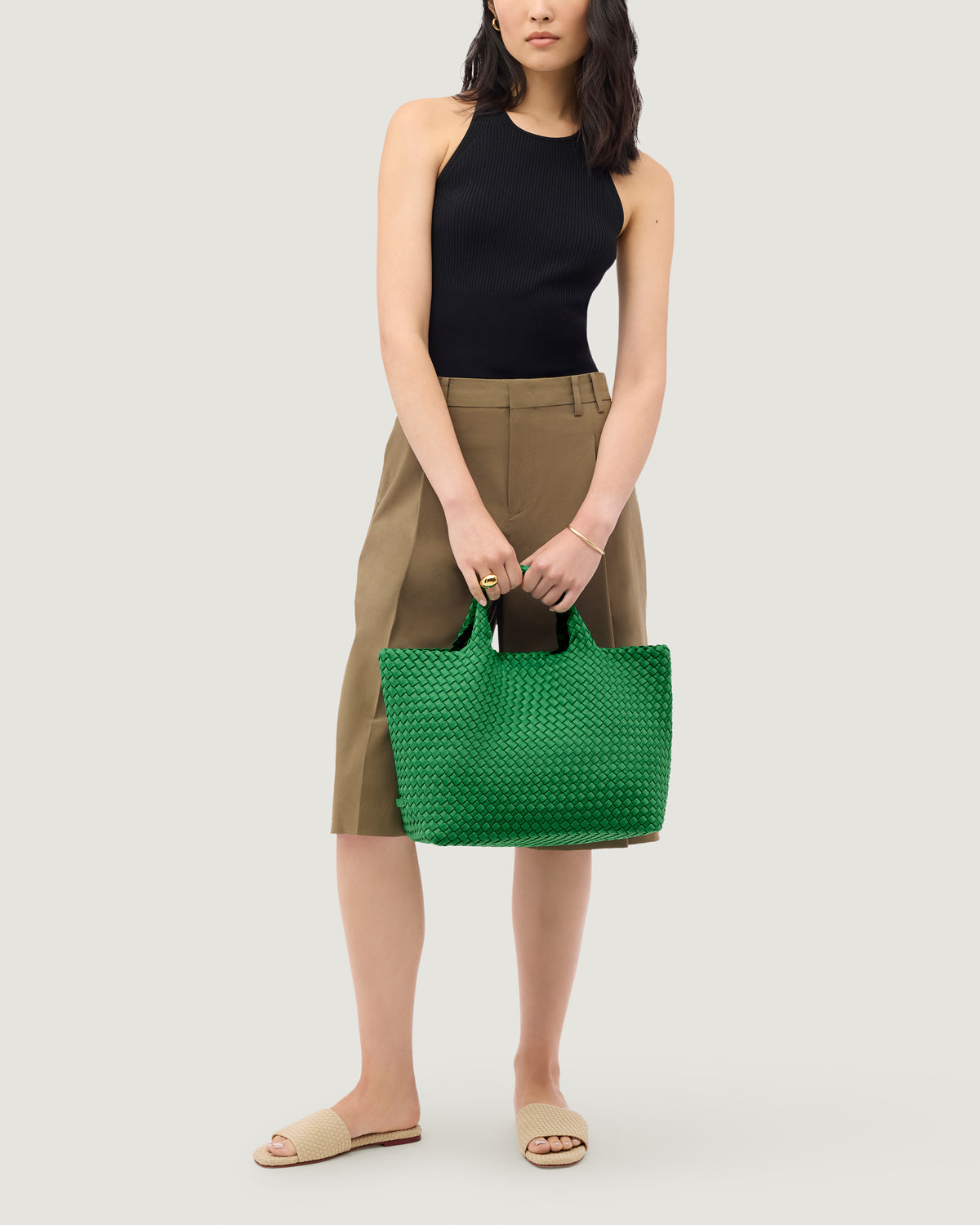 St. Barths Tote in Emerald shown on model to illustrate scale and soft silhouette.