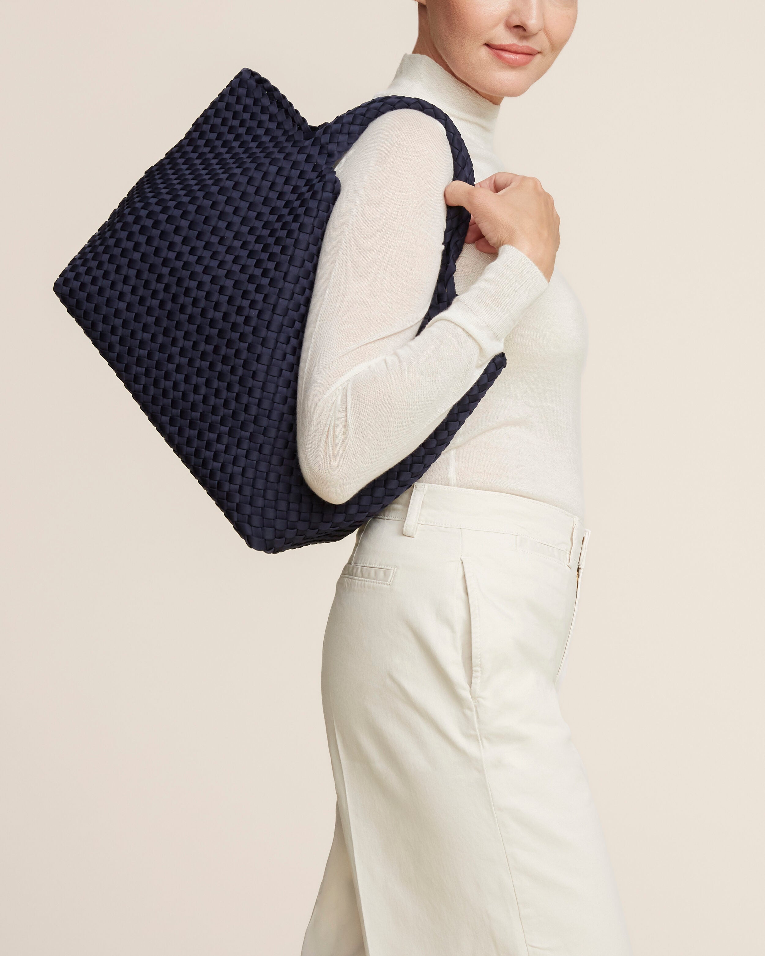 St. Barths Tote in Ink Blue shown on model to illustrate scale and soft silhouette.