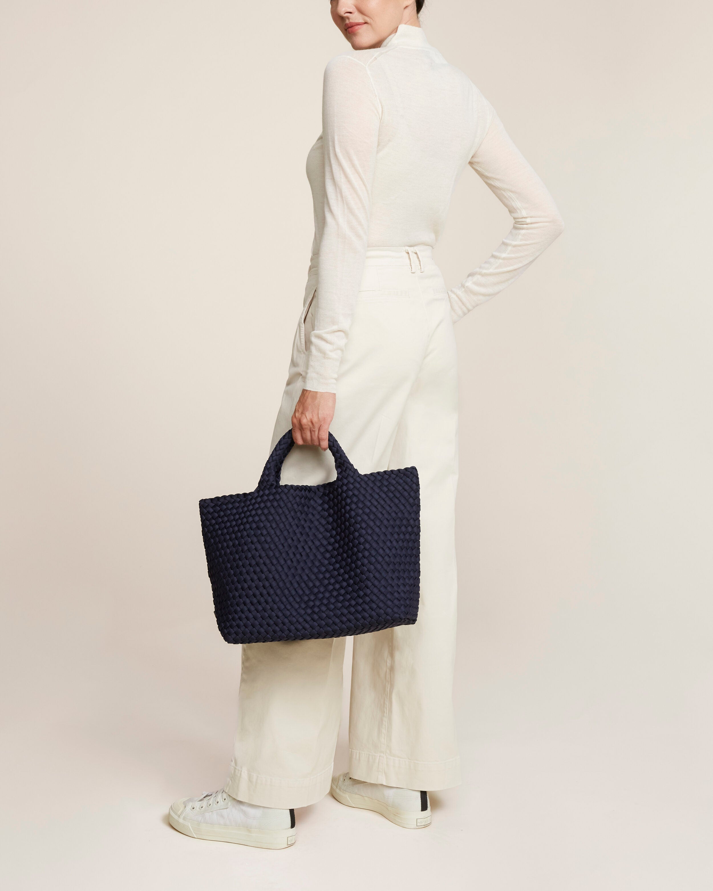 St. Barths Tote in Ink Blue shown on model to illustrate scale and soft silhouette.