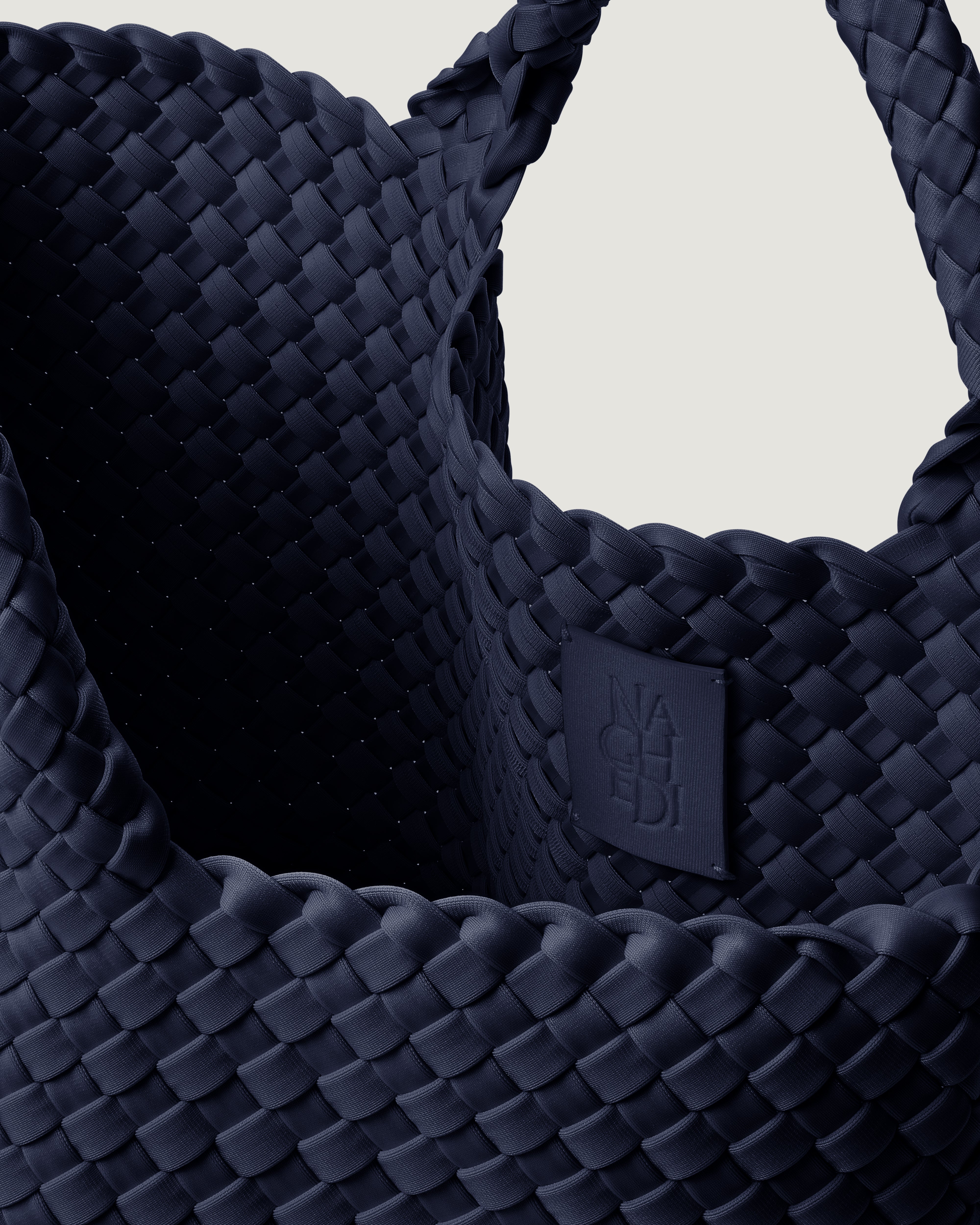 Interior close-up of St. Barths Tote in Ink Blue showing its open top, magnetic closure, and unlined interior.