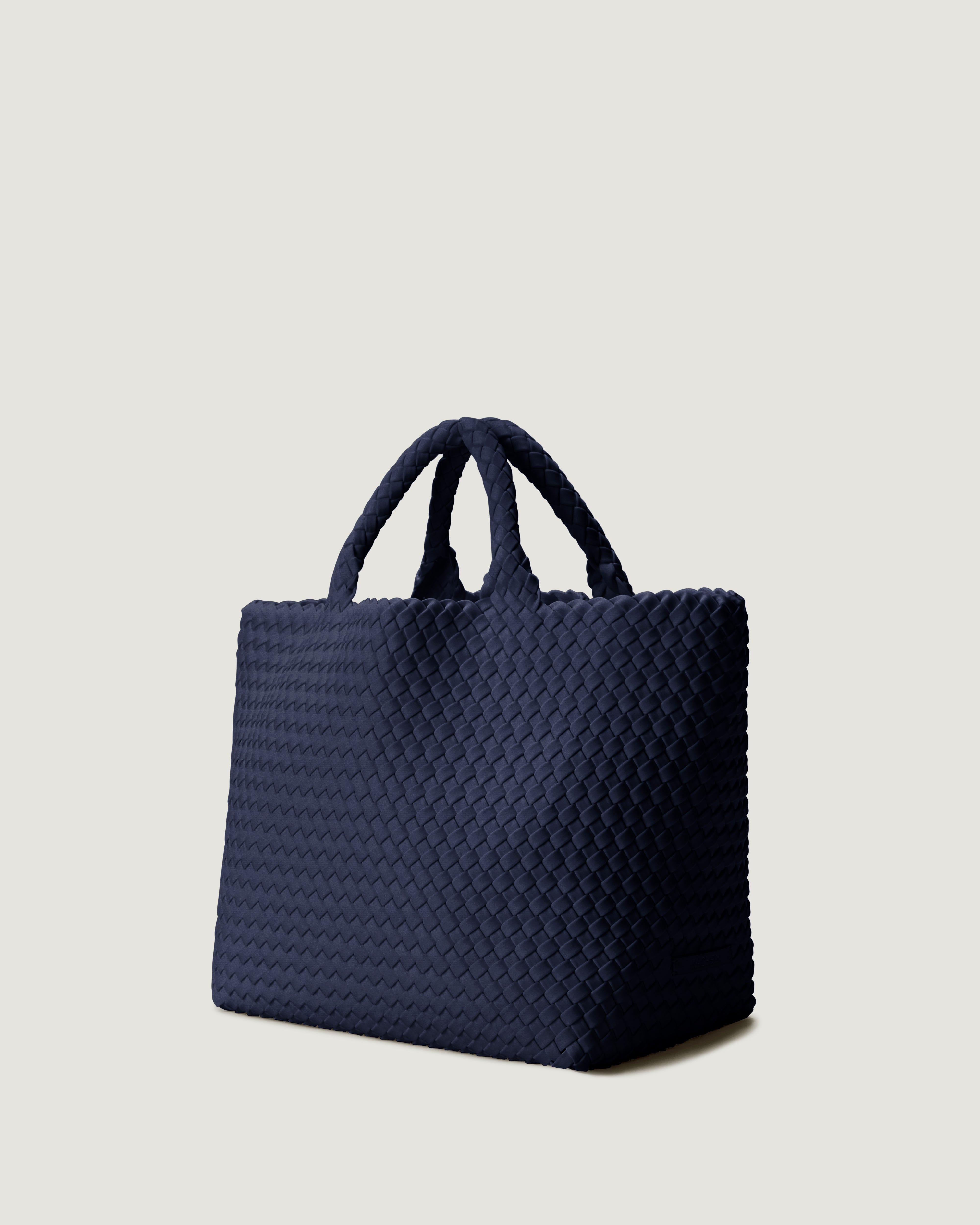 Side view of ink blue medium handwoven neoprene tote bag