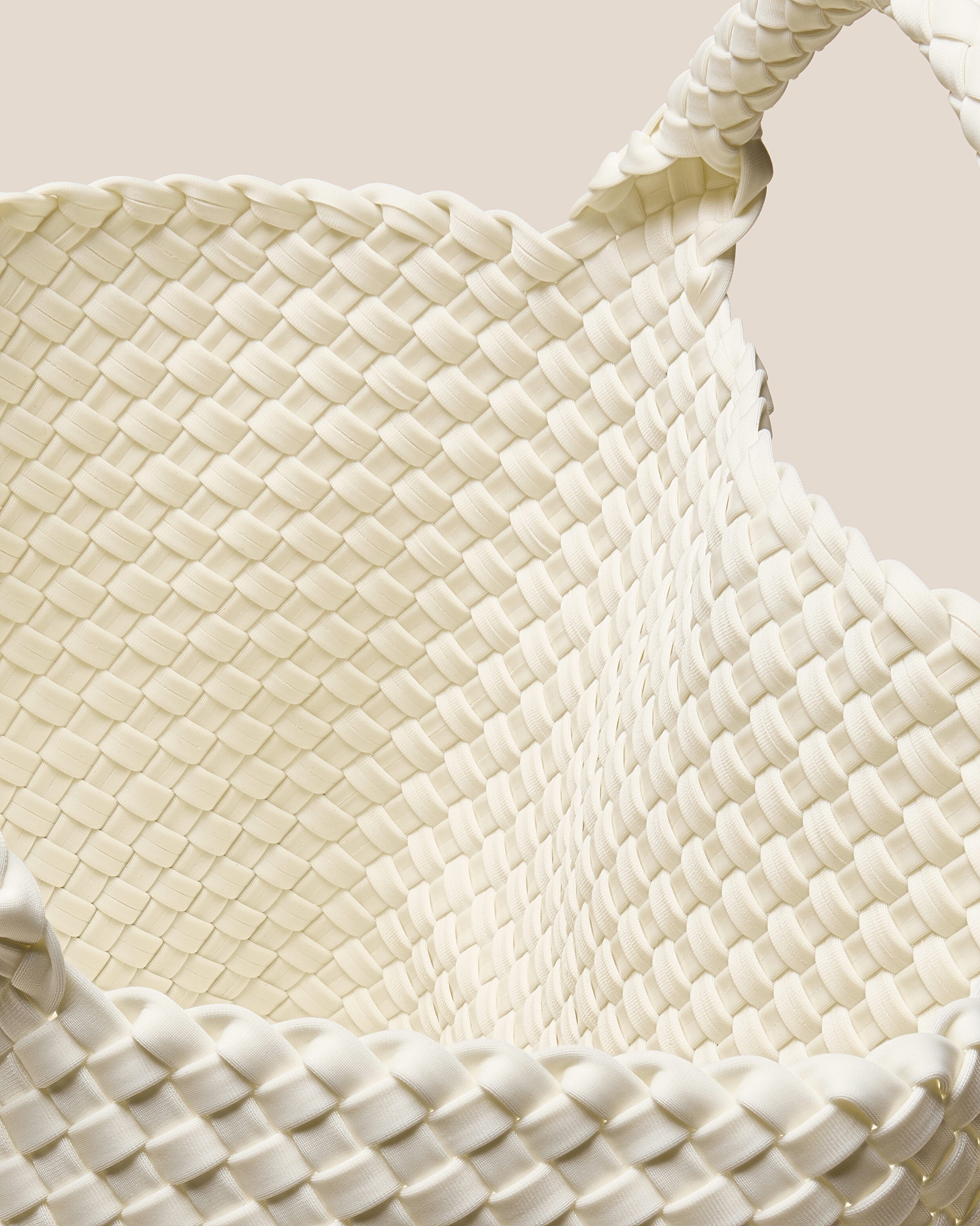 Interior close-up of St. Barths Tote in Jasmine showing its open top, and unlined interior.