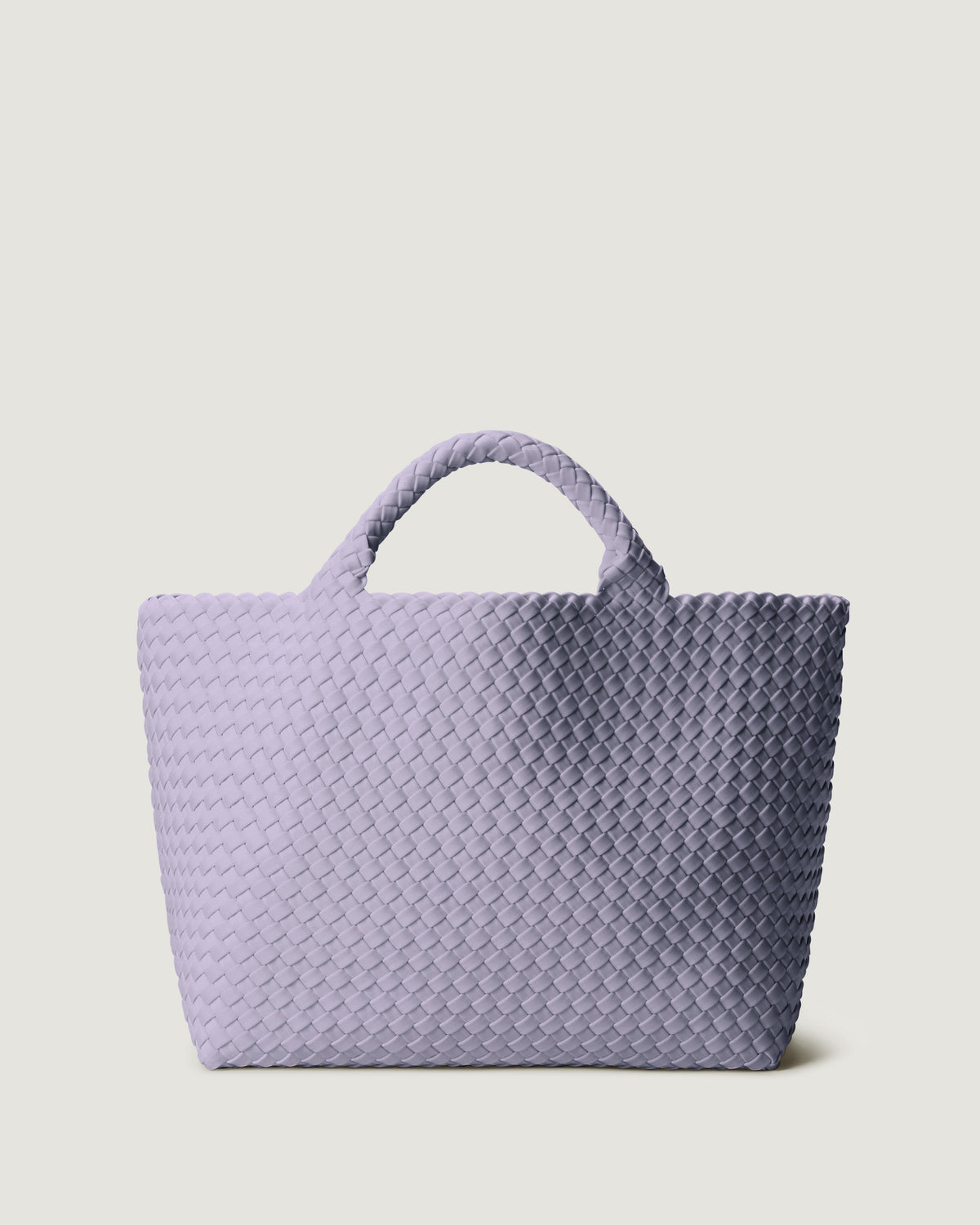 St. Barths Tote in Lilac in handwoven neoprene, featuring a magnetic closure, and woven top handles.