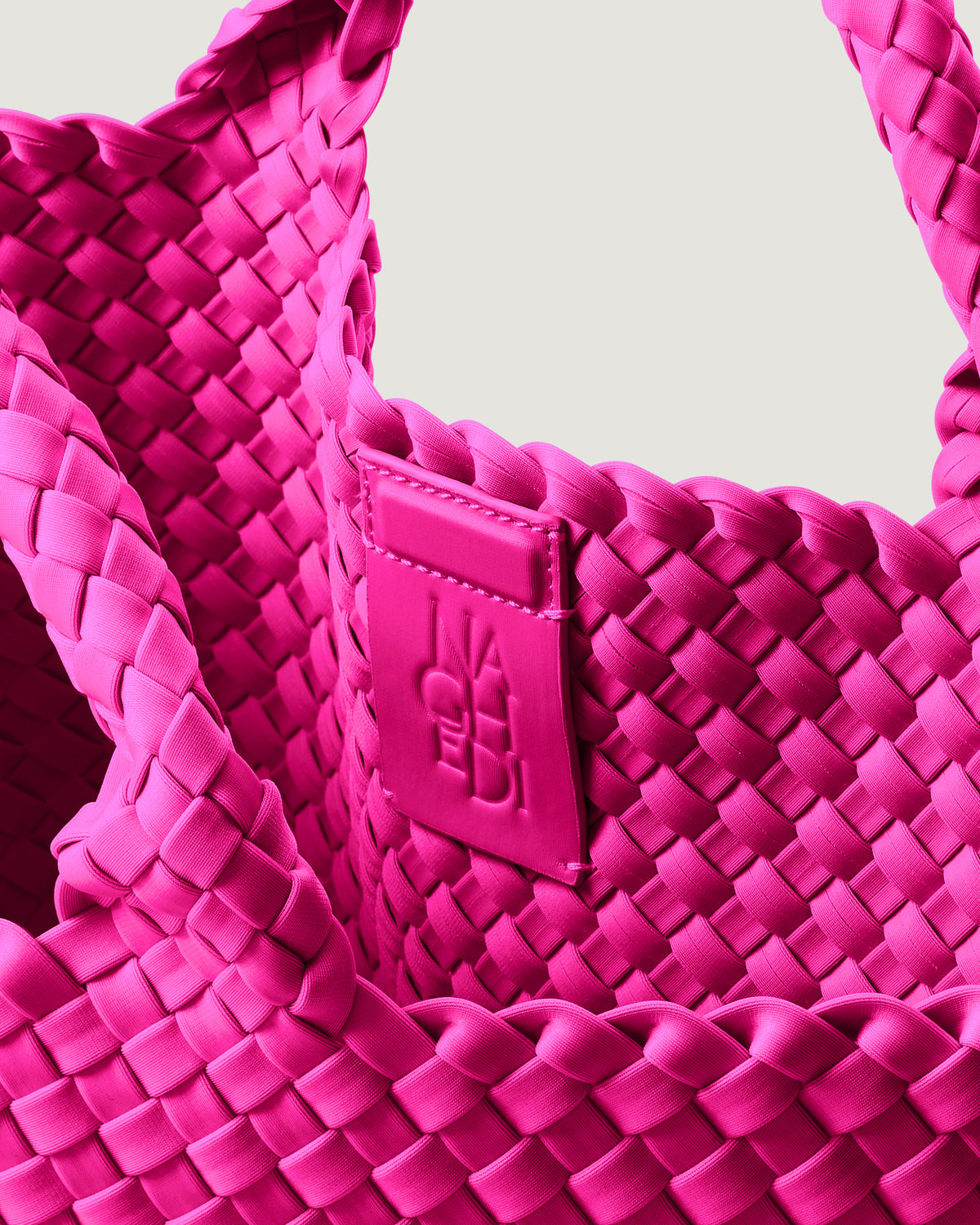 Interior close-up of St. Barths Tote in Miami Pink showing its magnetic snap closure, and unlined interior.
