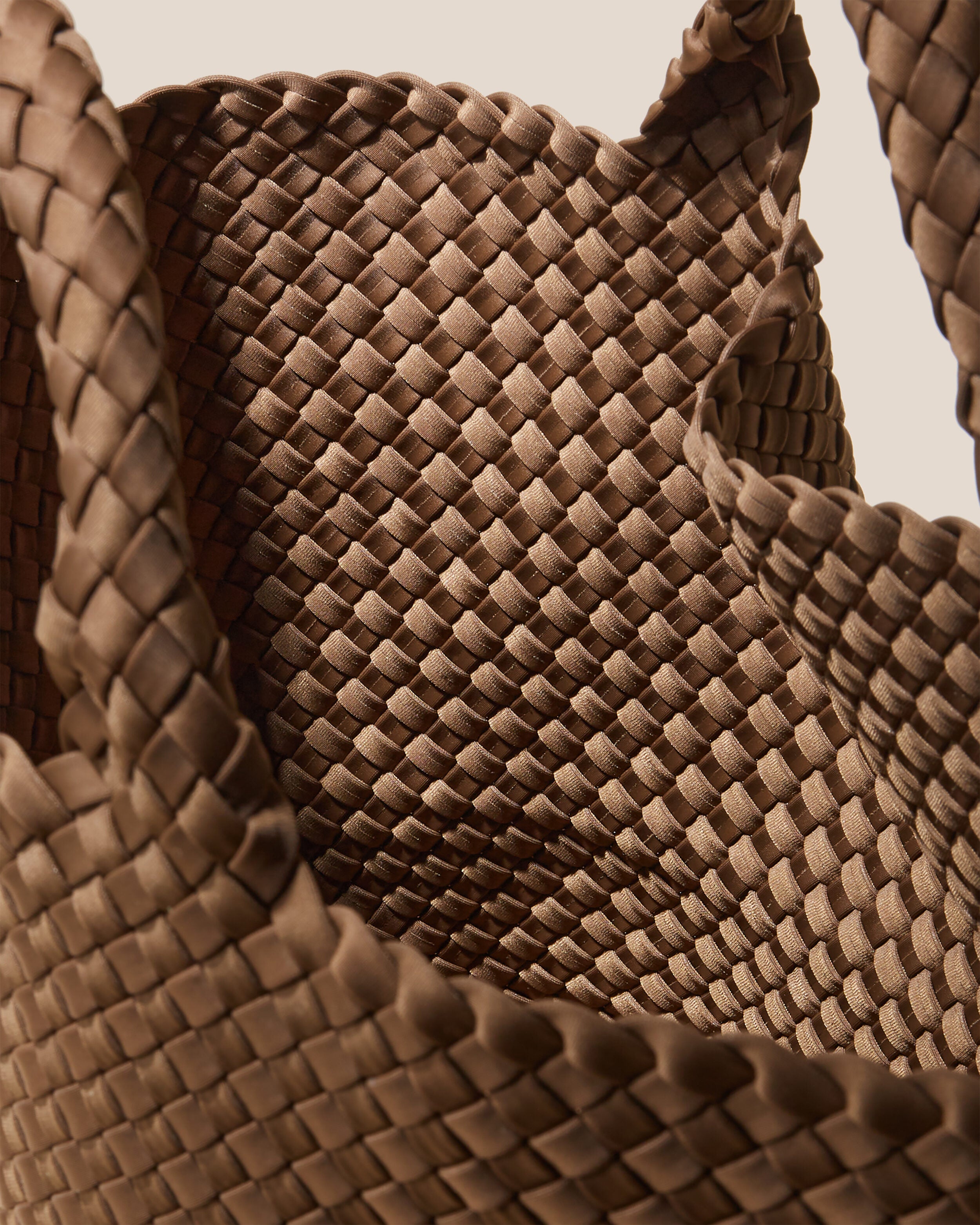 Interior close-up of St. Barths Tote in Mink showing its open top, and unlined interior.