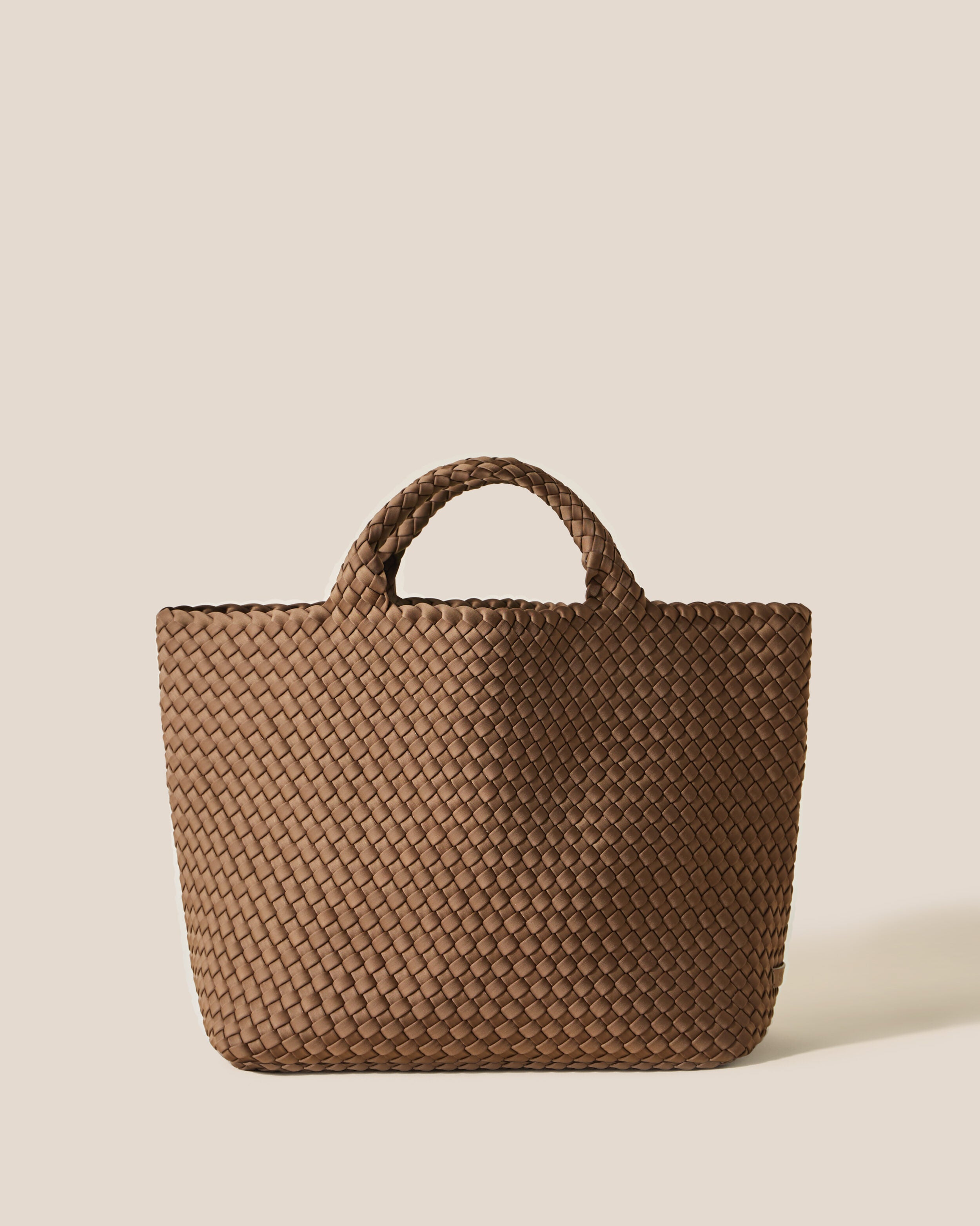 St. Barths Tote in Mink, a brown tone, in handwoven neoprene, featuring an open top, and woven top handles.