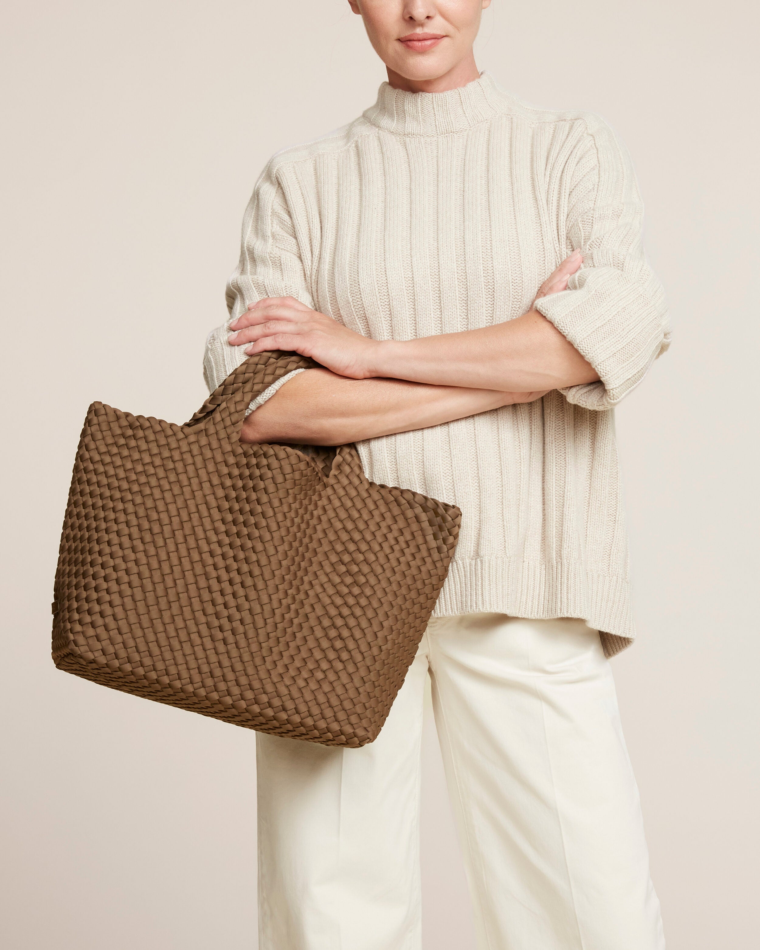 St. Barths Tote in Mink shown on model to illustrate scale and soft silhouette.