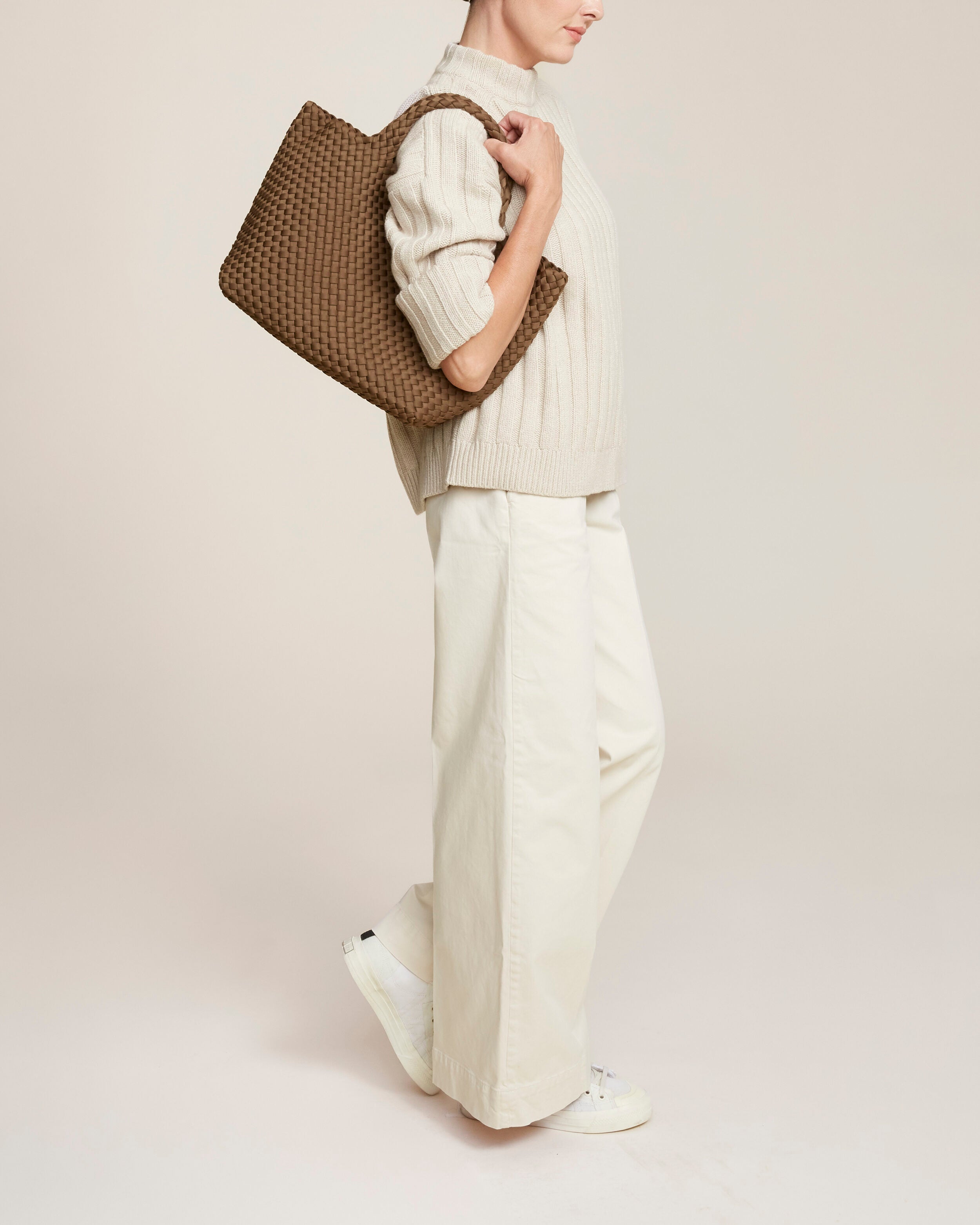 St. Barths Tote in Mink shown on model to illustrate scale and soft silhouette.