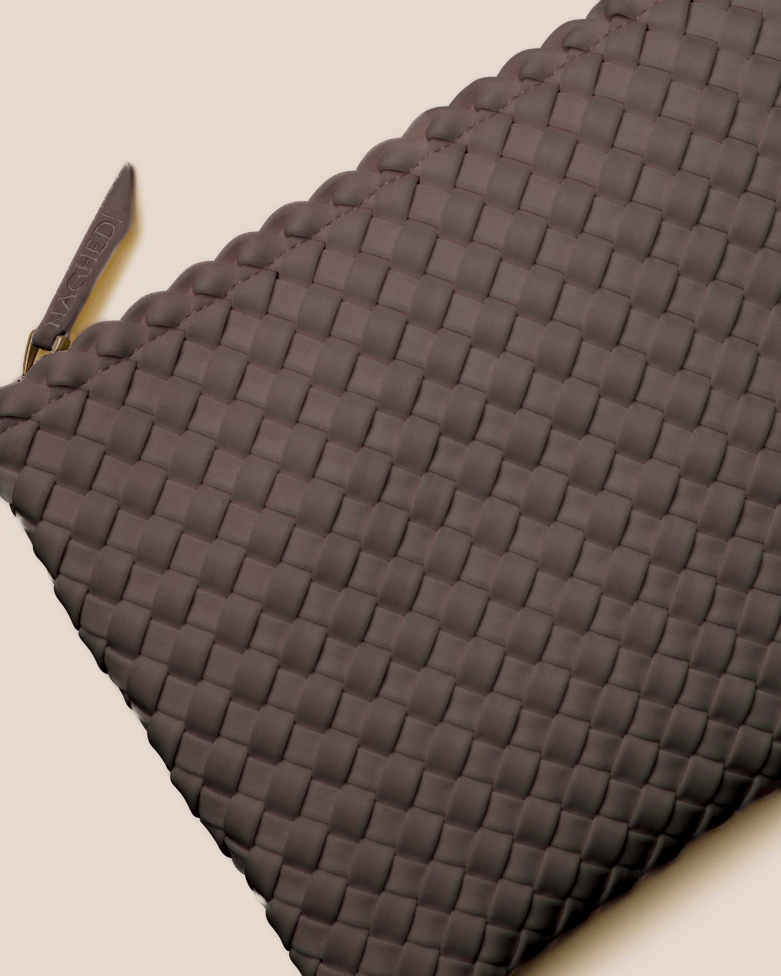 Close-up of included matching woven zippered pouch.