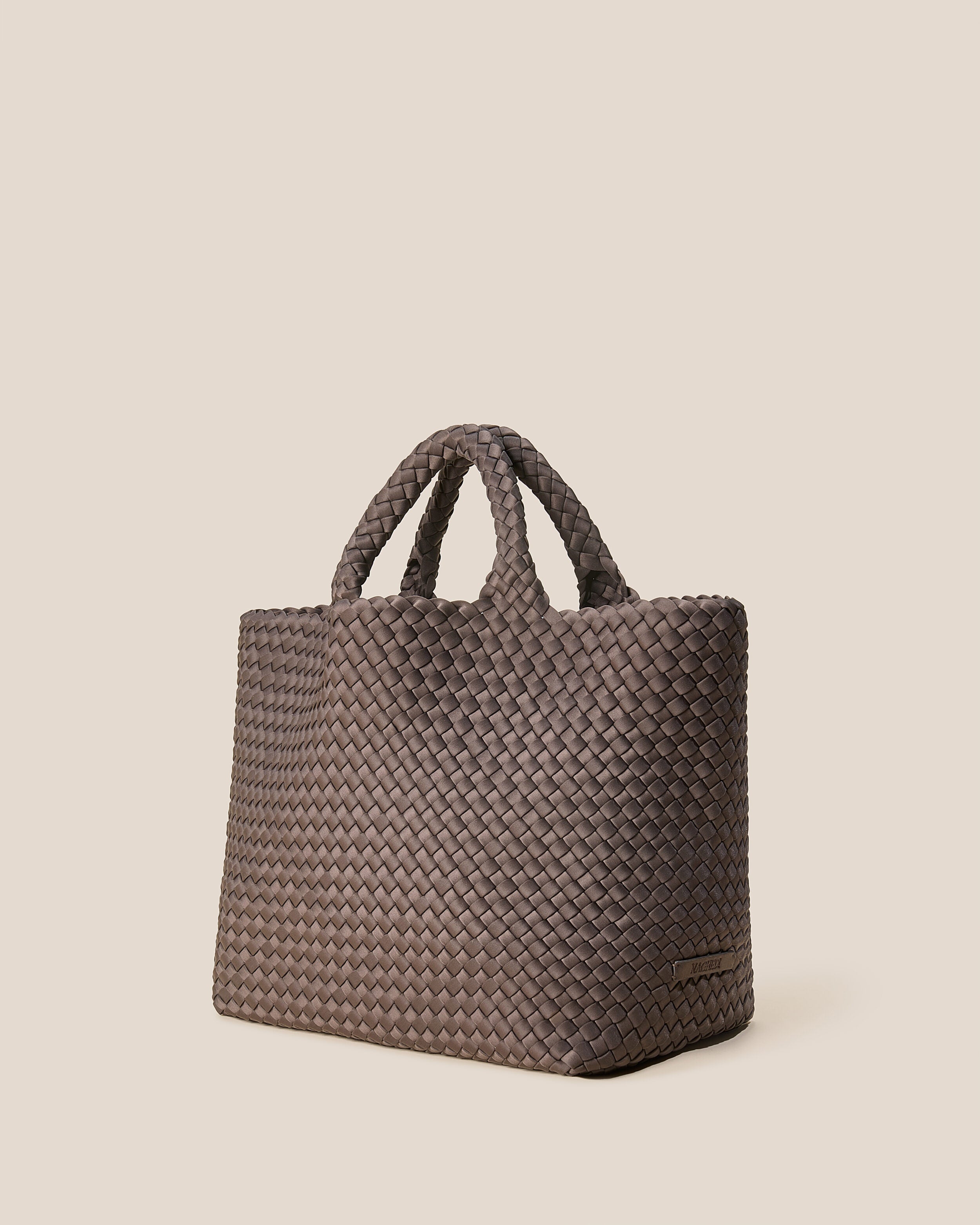 St. Barths Tote in Napa shown from a side angle, highlighting its handwoven neoprene construction and open top.