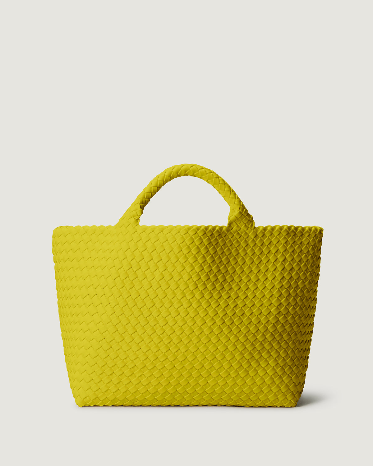 St. Barths Tote in Ochre in handwoven neoprene, featuring a magnetic closure, and woven top handles.