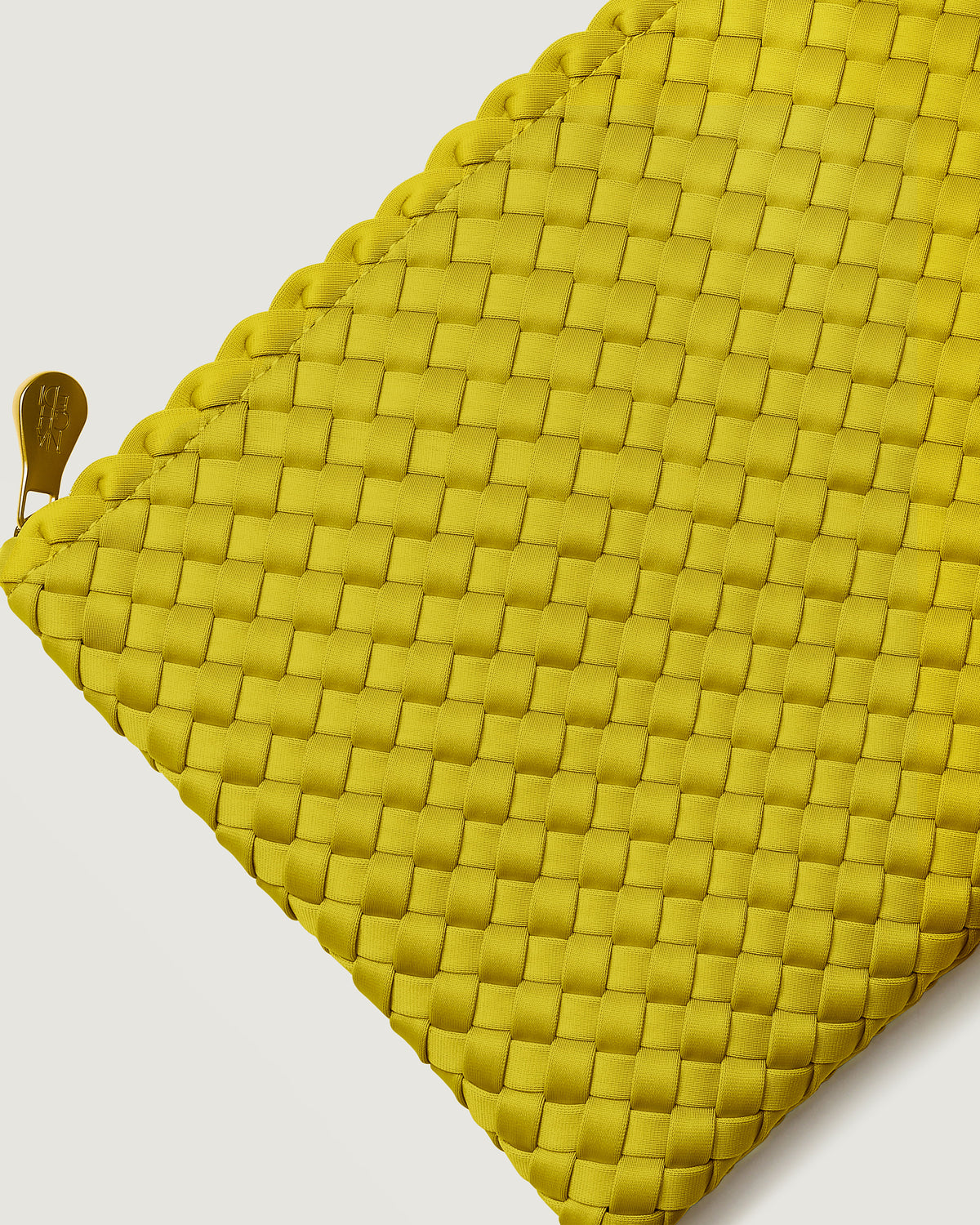 Close-up of included matching woven zippered pouch.