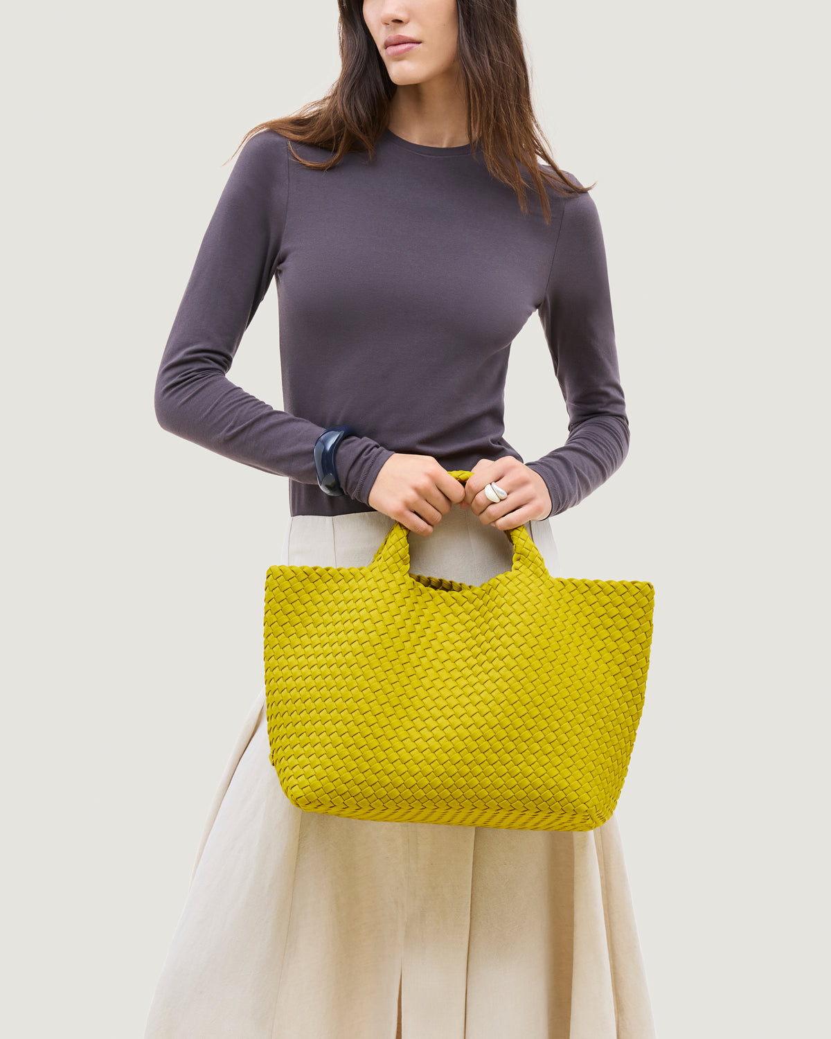 St. Barths Tote in Ochre shown on model to illustrate scale and soft silhouette.