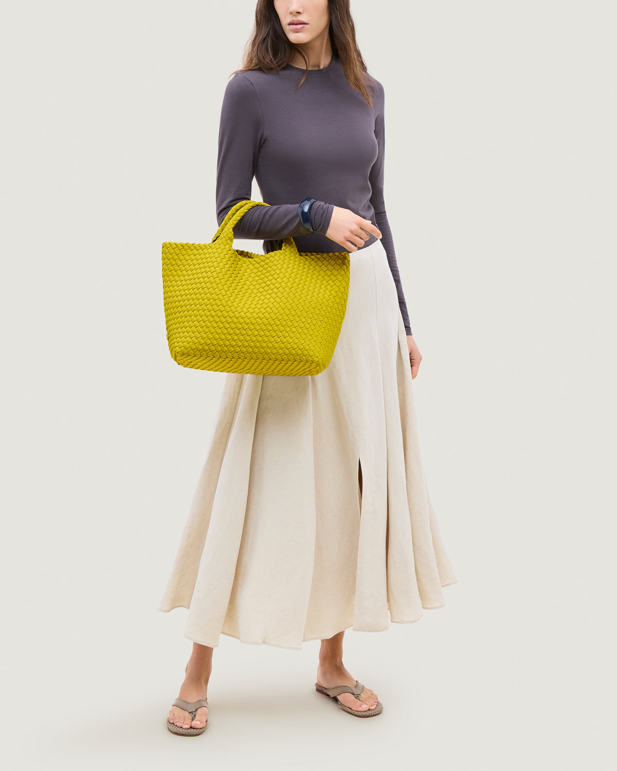 St. Barths Tote in Ochre shown on model to illustrate scale and soft silhouette.