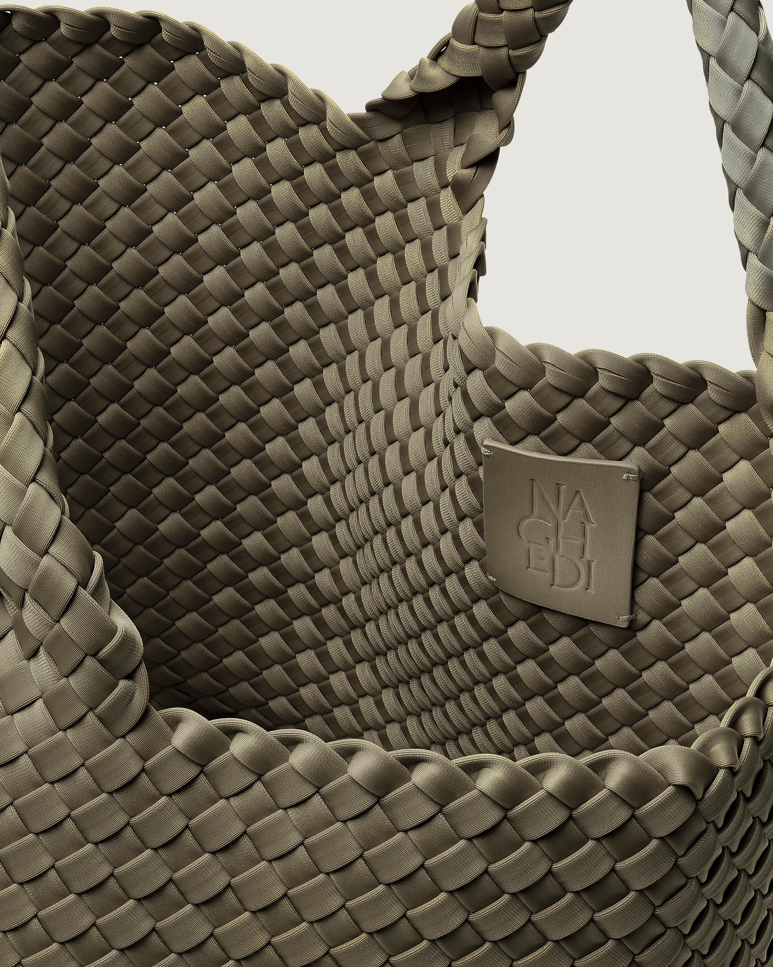 Interior close-up of St. Barths Tote in Olea showing its open top, and unlined interior.