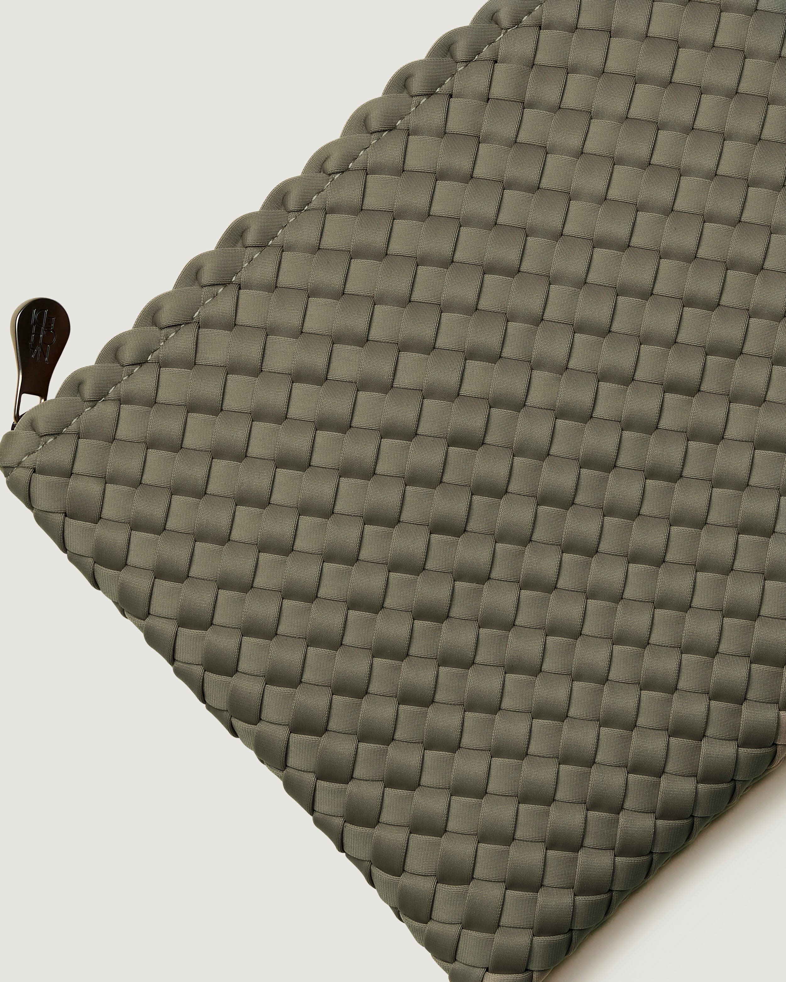 Close-up of included matching woven zippered pouch.