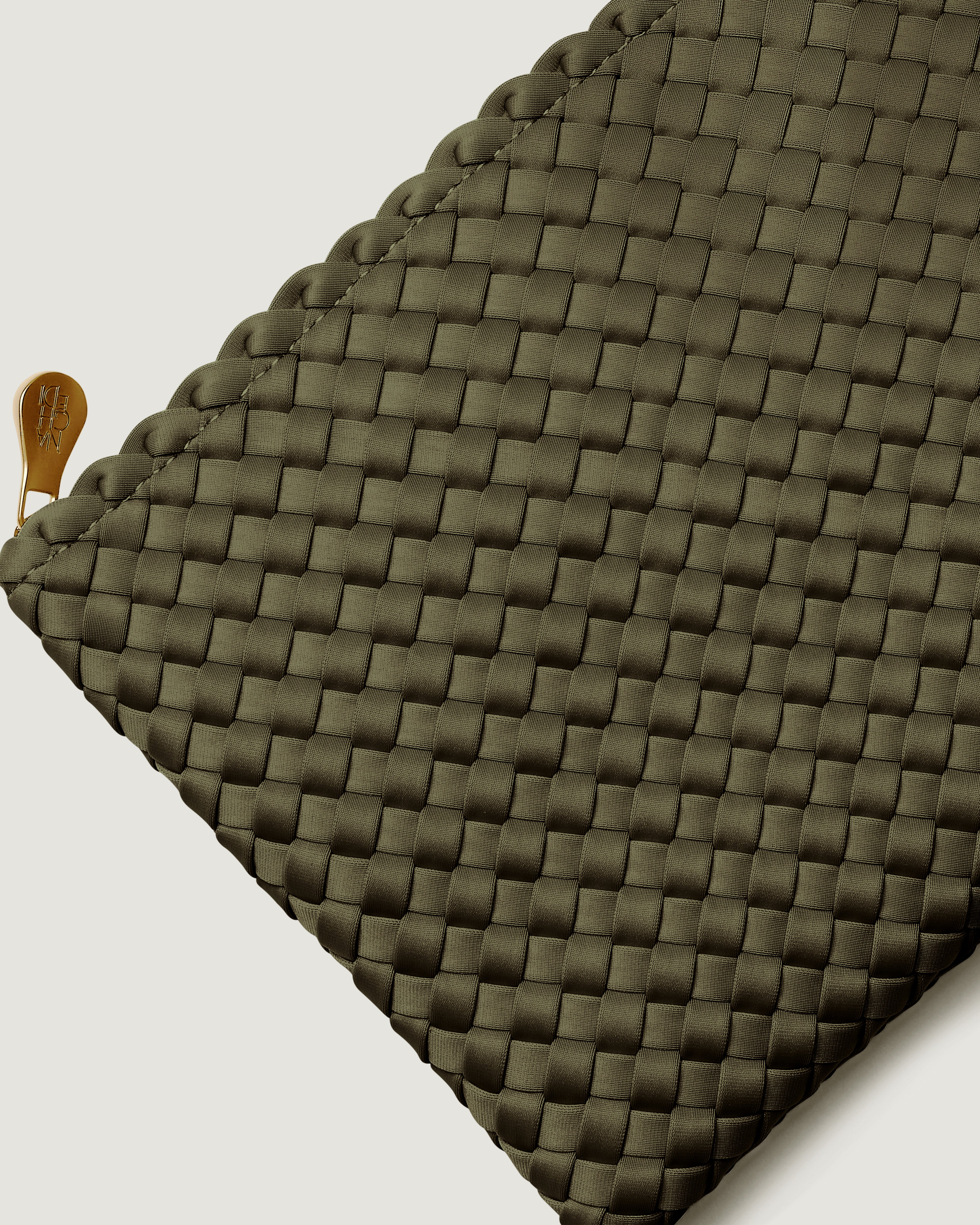 Close-up of included matching woven zippered pouch.