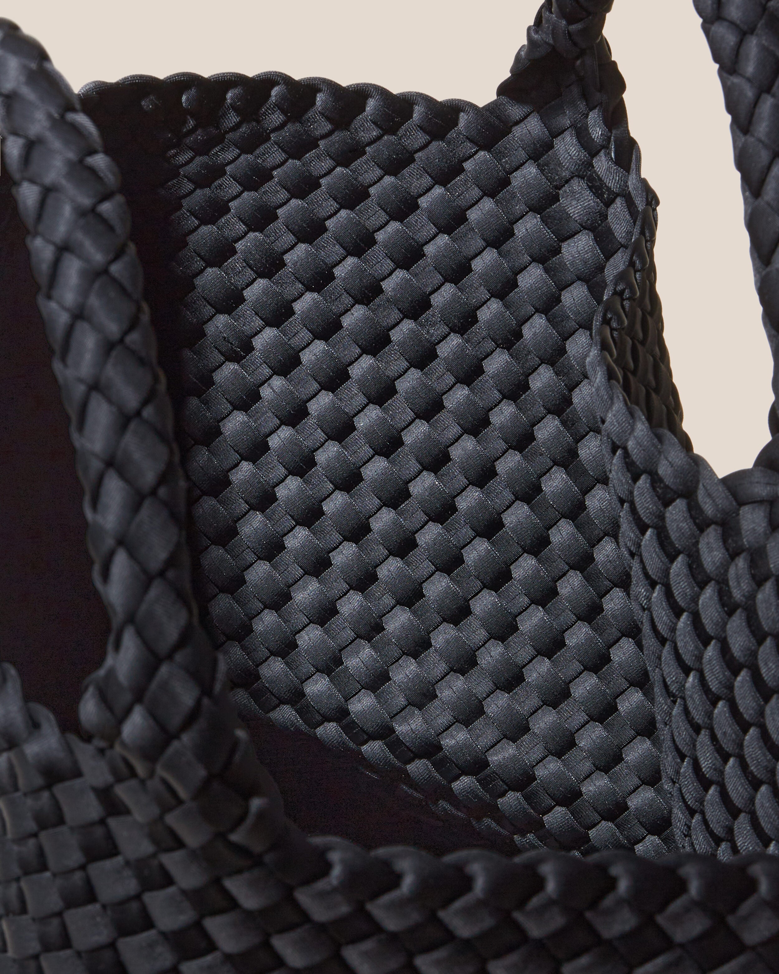 Interior close-up of St. Barths Tote in Onyx showing its open top, and unlined interior.