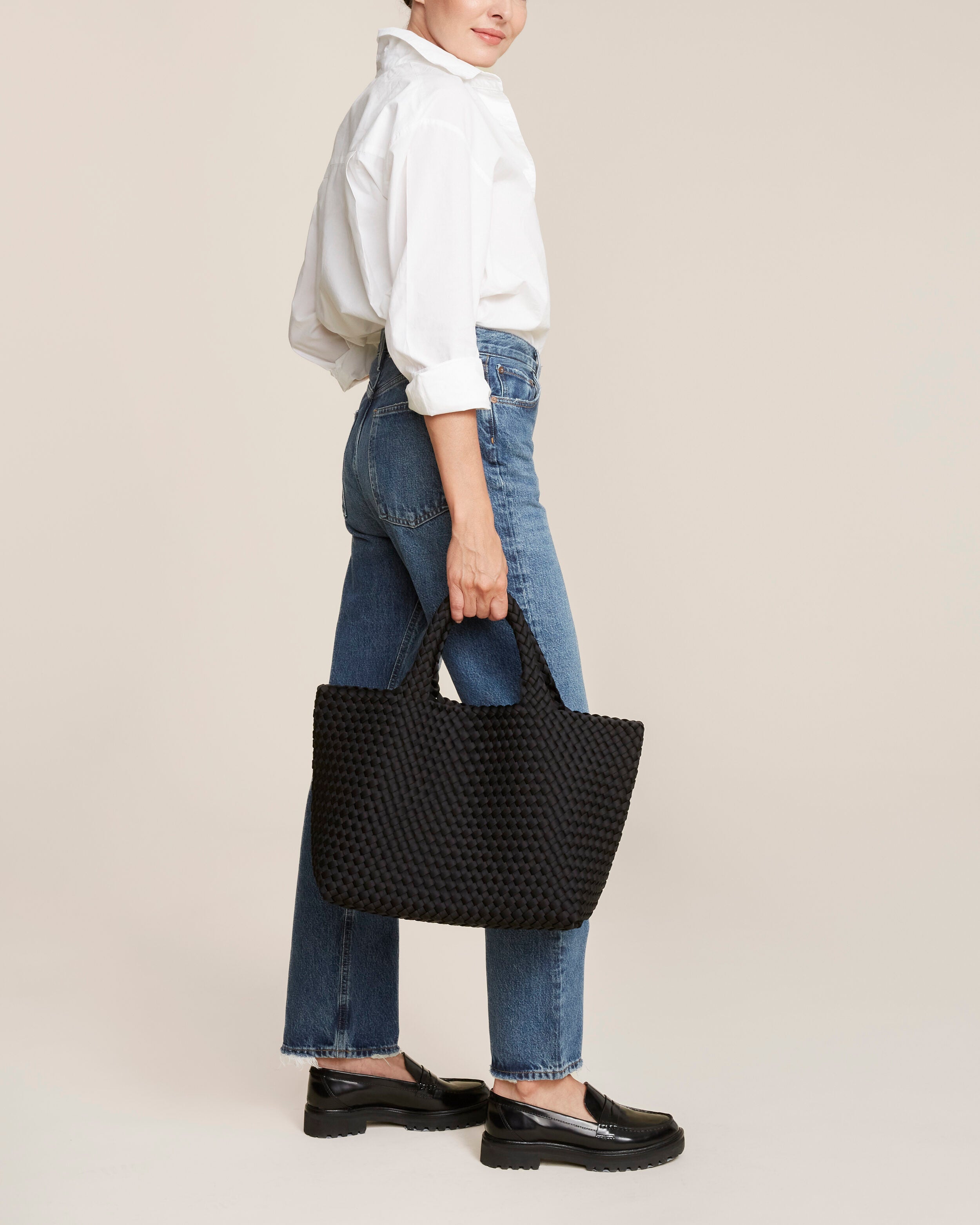 St. Barths Tote in Onyx shown on model to illustrate scale and soft silhouette.