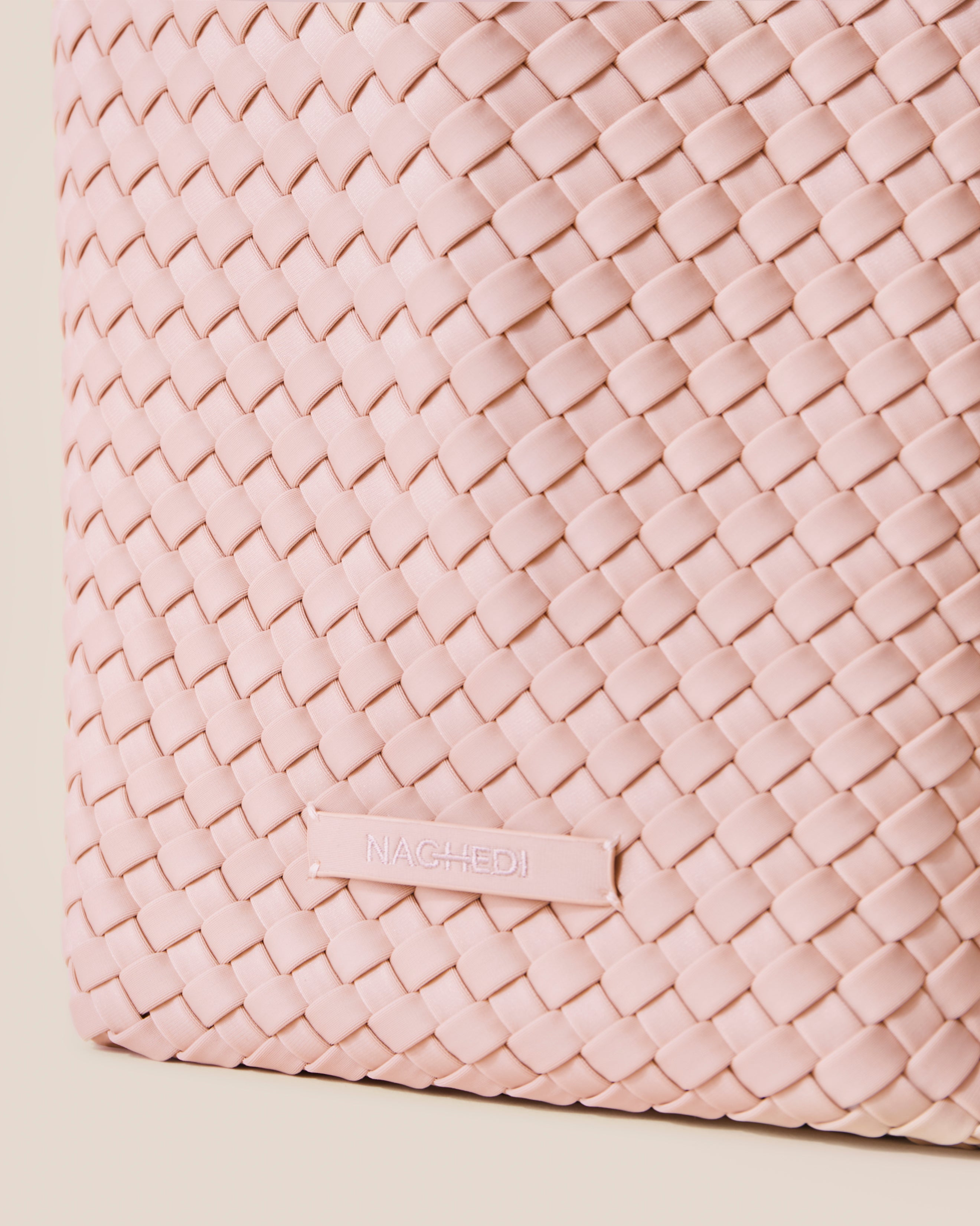 Close-up of stamped NAGHEDI logo on St. Barths in Petal.