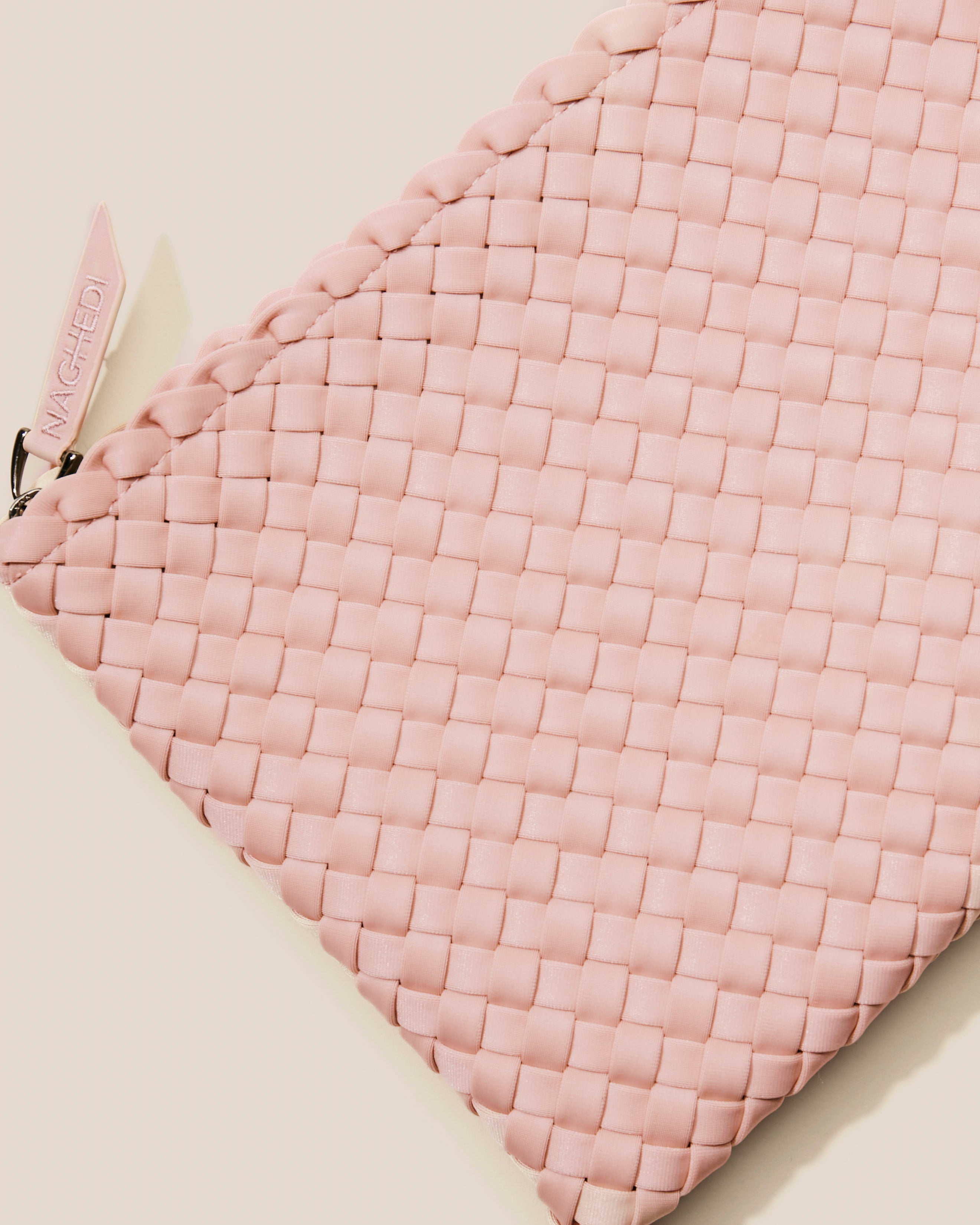 Close-up of included matching woven zippered pouch.