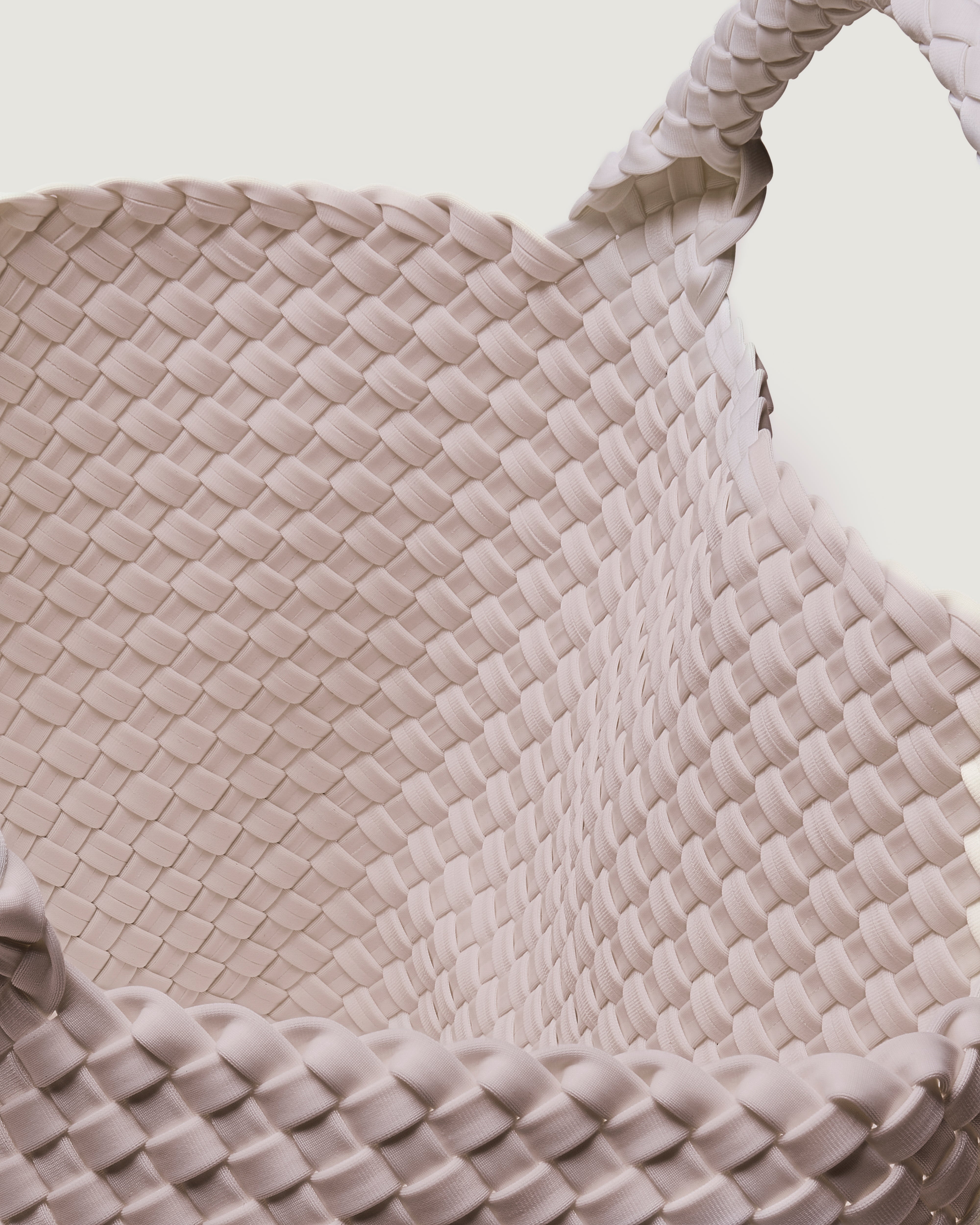 Interior close-up of St. Barths Tote in Bottle Green showing its open top, and unlined interior.