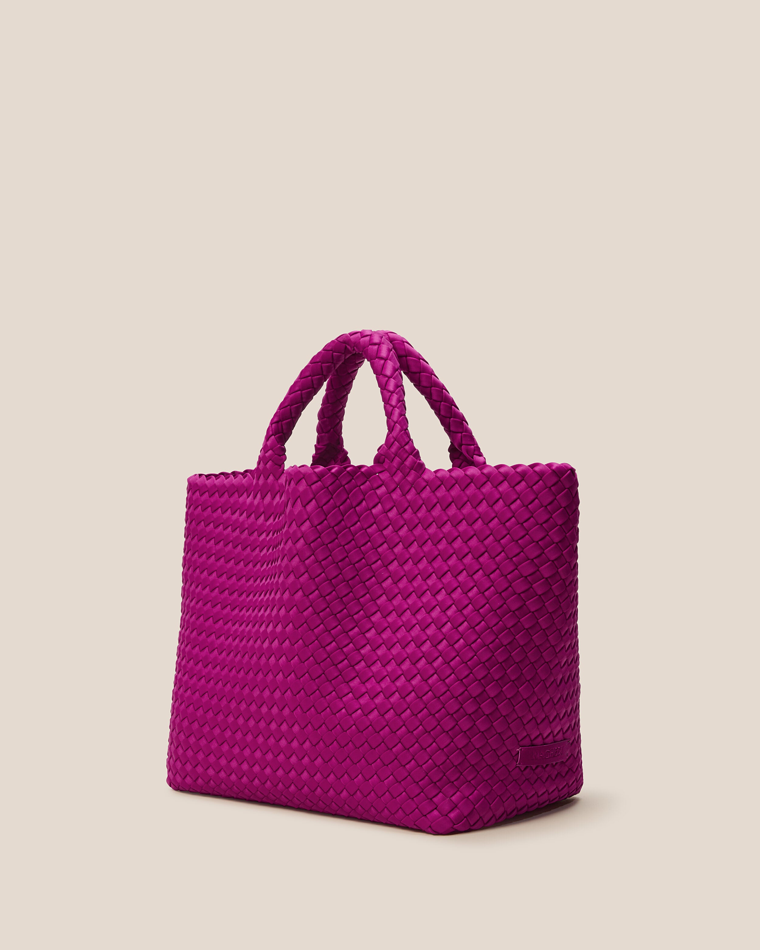 St. Barths Tote in Rio shown from a side angle, highlighting its handwoven neoprene construction and open top.