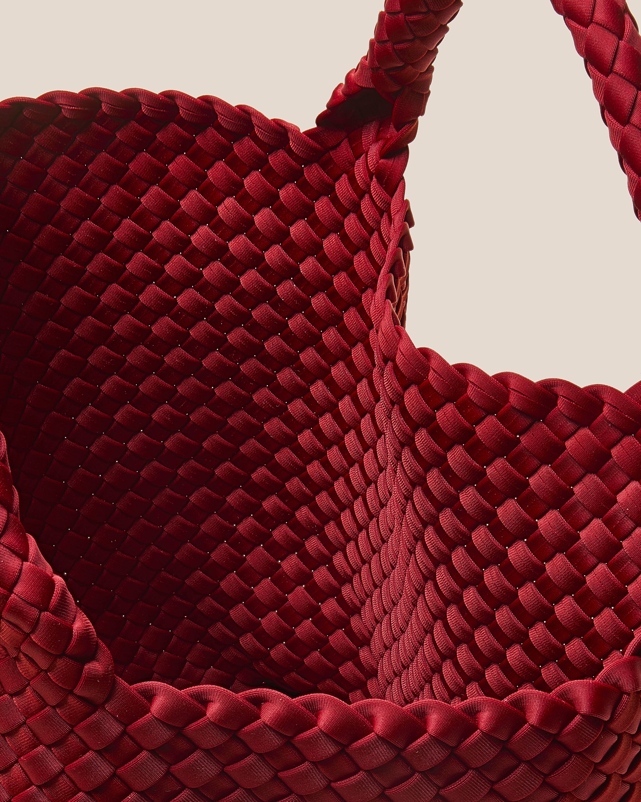 Interior close-up of St. Barths Tote in Rosso showing its open top, and unlined interior.