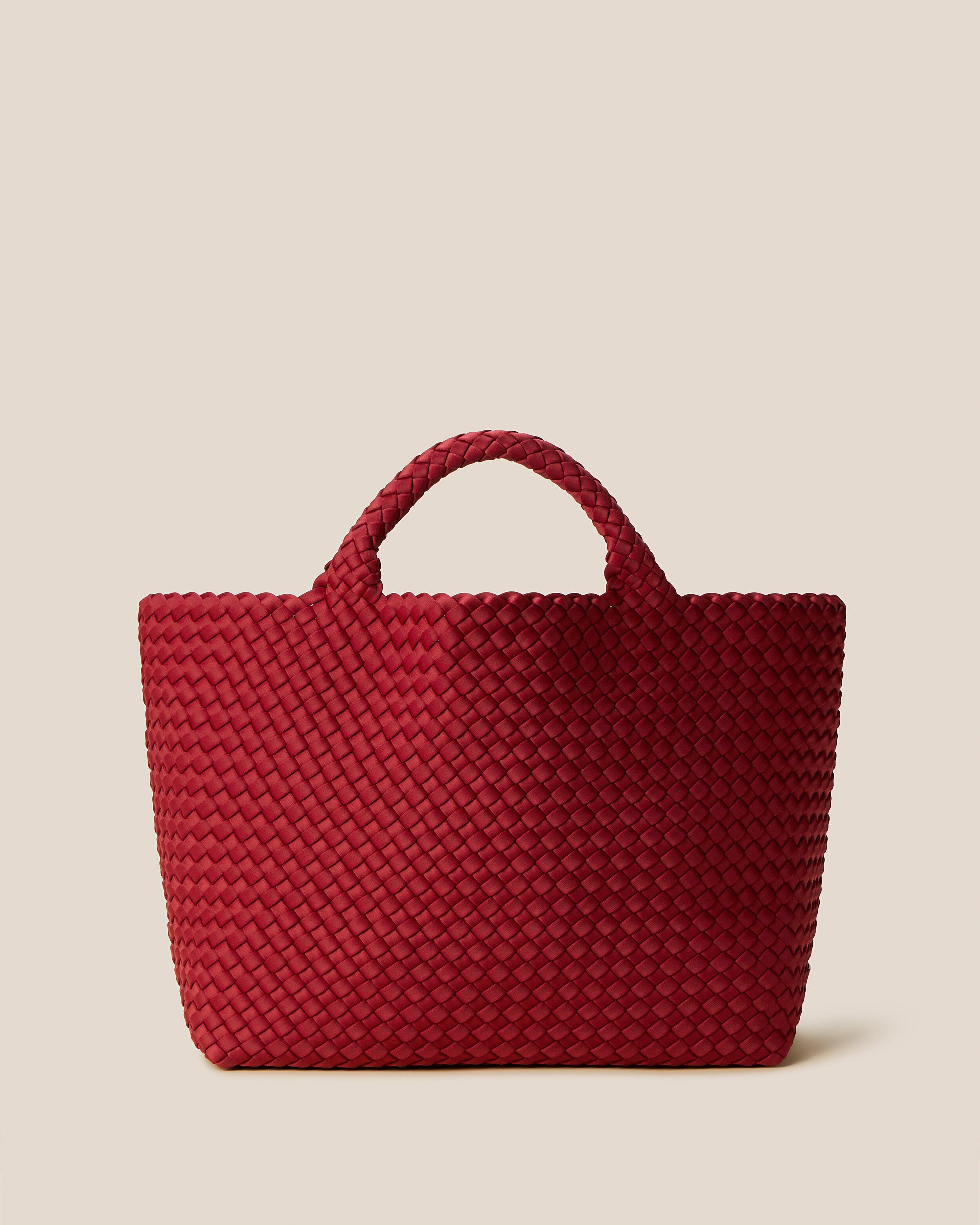 St. Barths Tote in Rosso, a rich red tone, in handwoven neoprene, featuring an open top, and woven top handles.