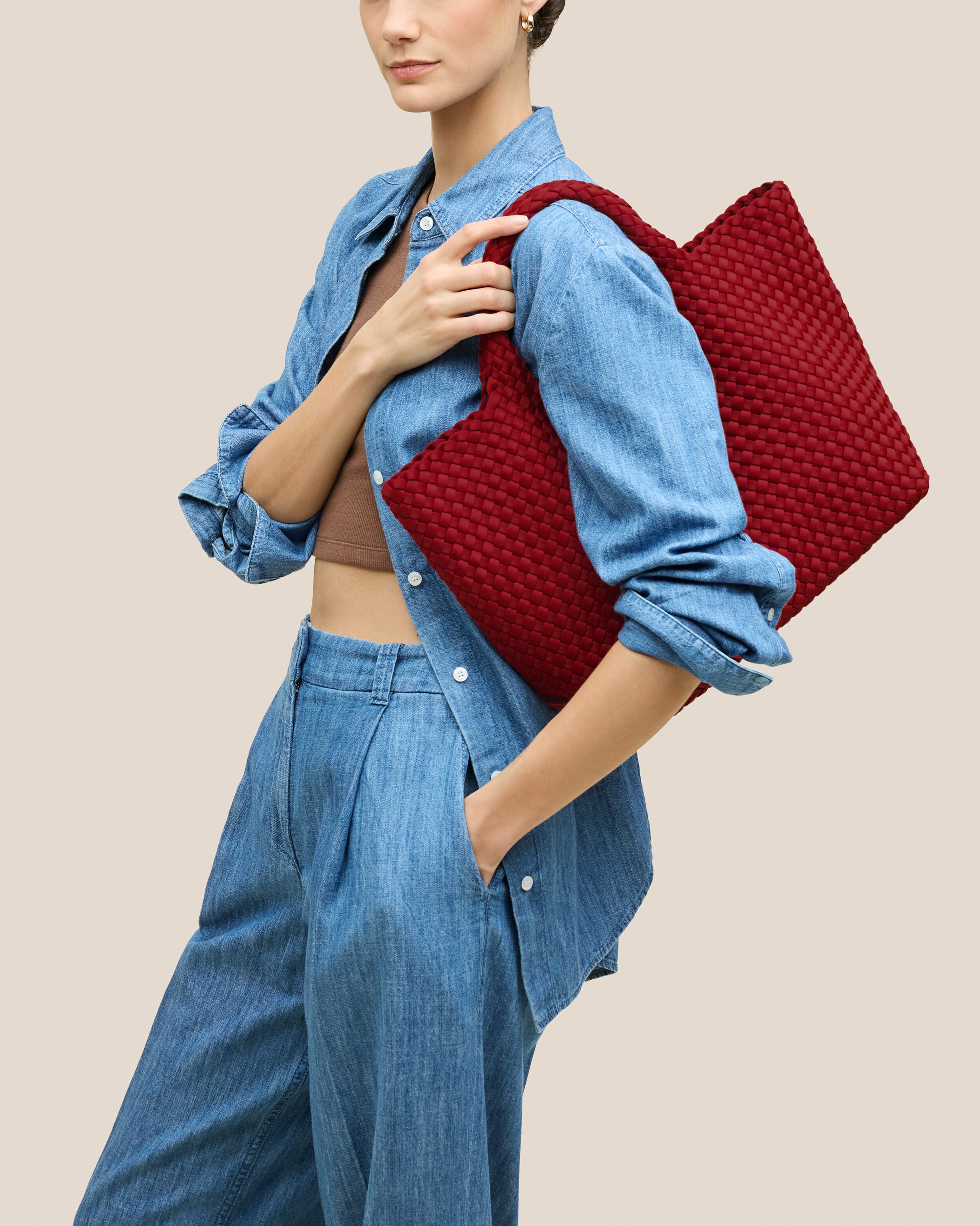St. Barths Tote in Rosso shown on model to illustrate scale and soft silhouette.