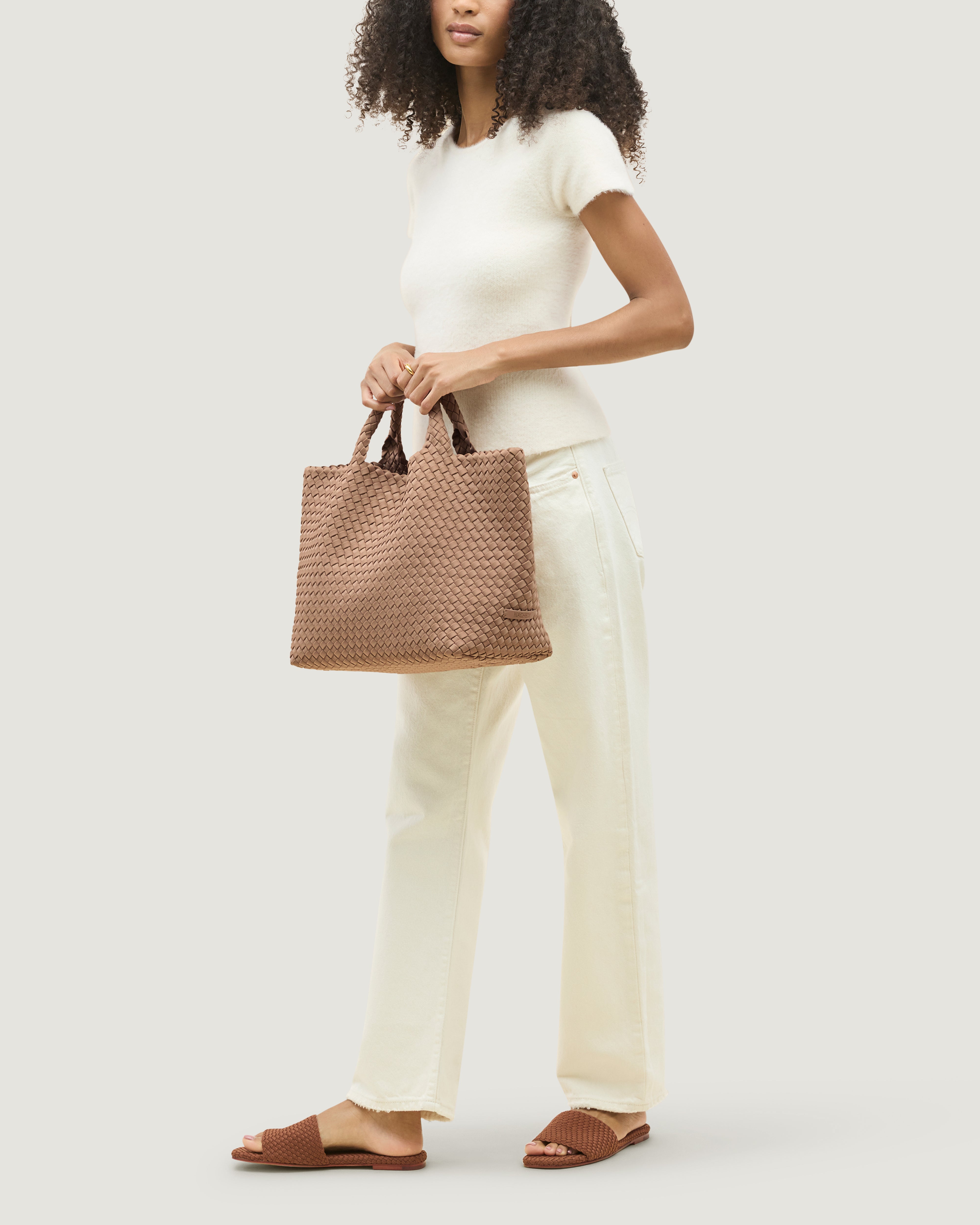 St. Barths Tote in Seychelles shown on model to illustrate scale and soft silhouette.
