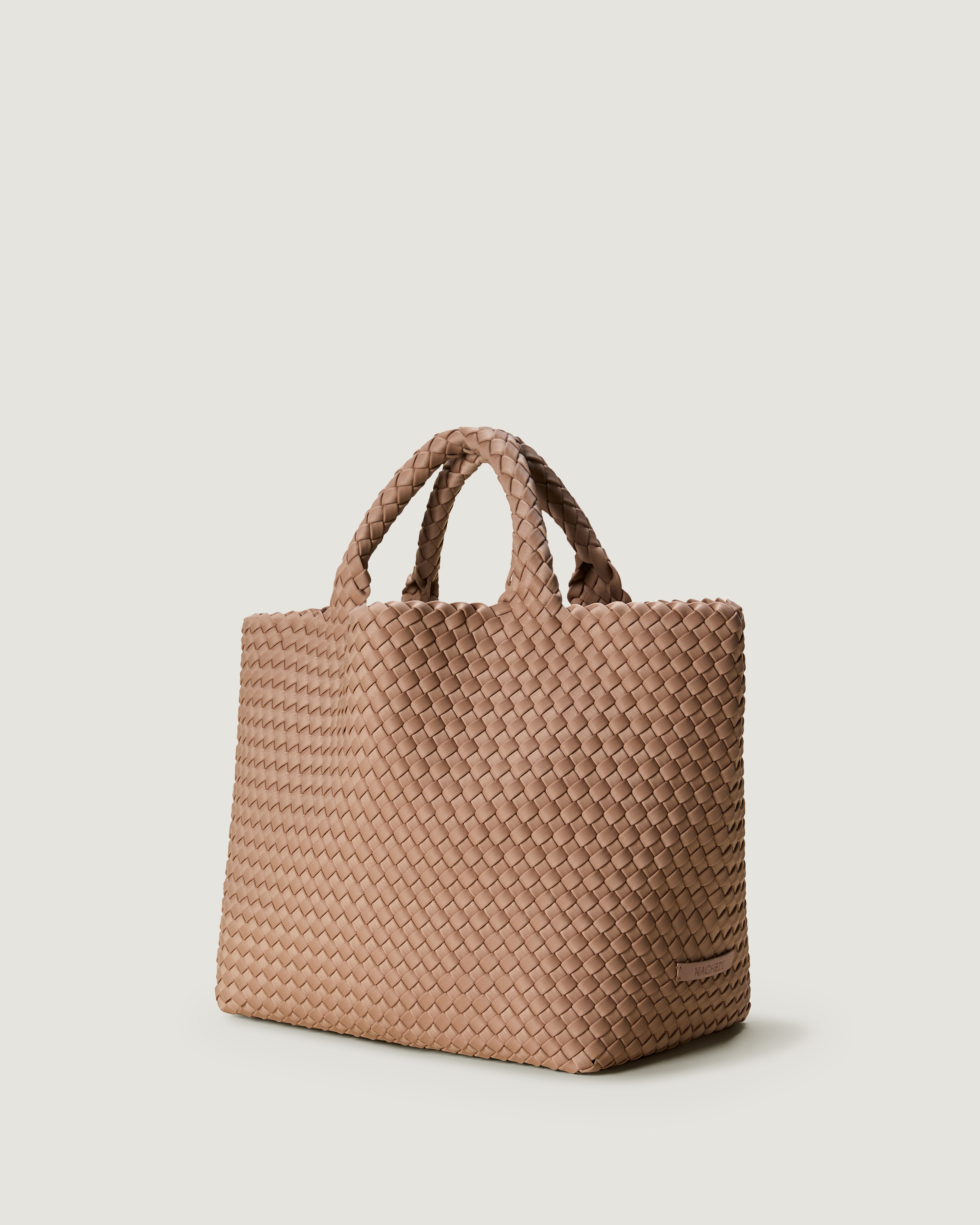St. Barths Tote in Seychelles shown from a side angle, highlighting its handwoven neoprene construction and open top.