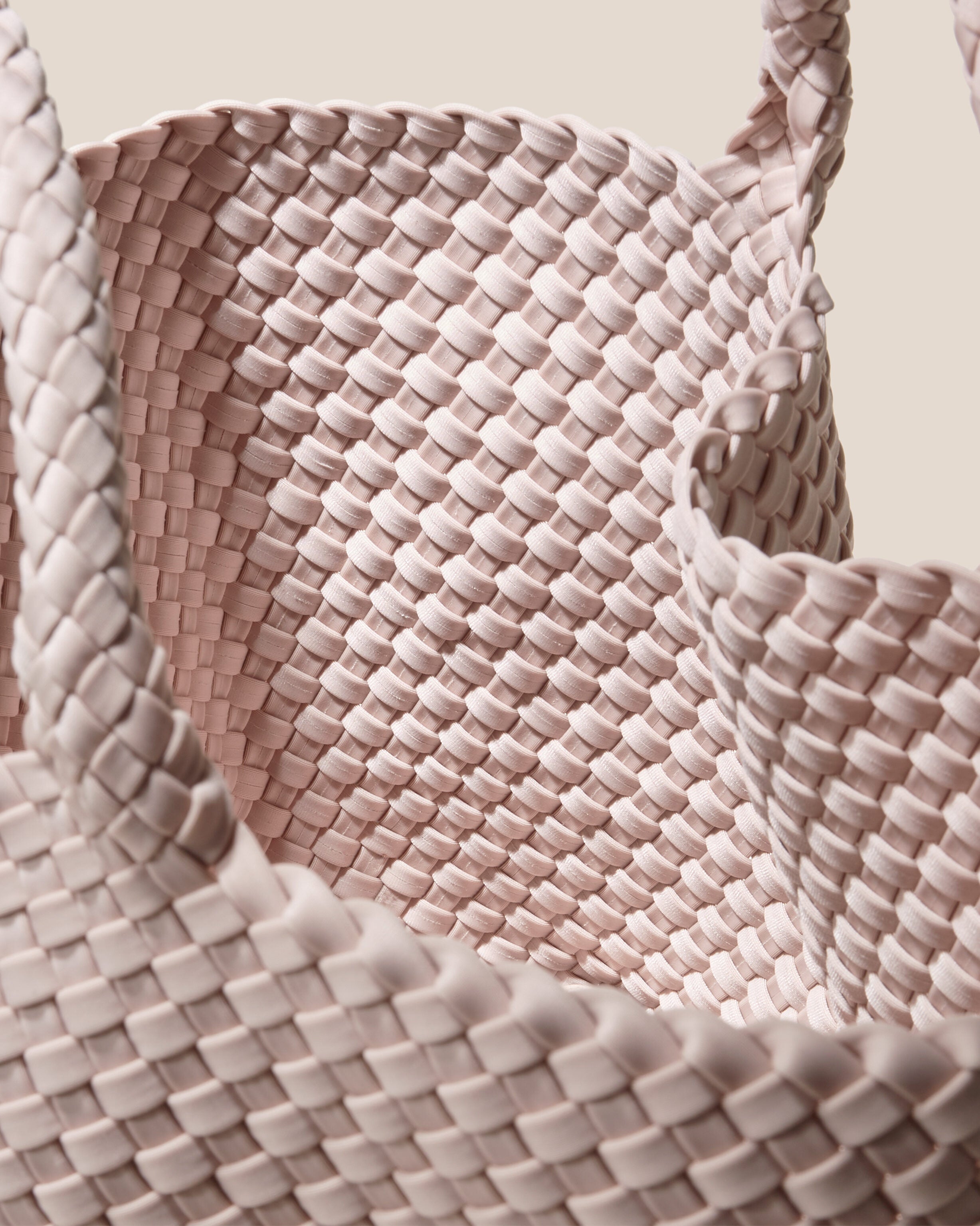 Interior close-up of St. Barths Tote in Shell Pink showing its open top, and unlined interior.